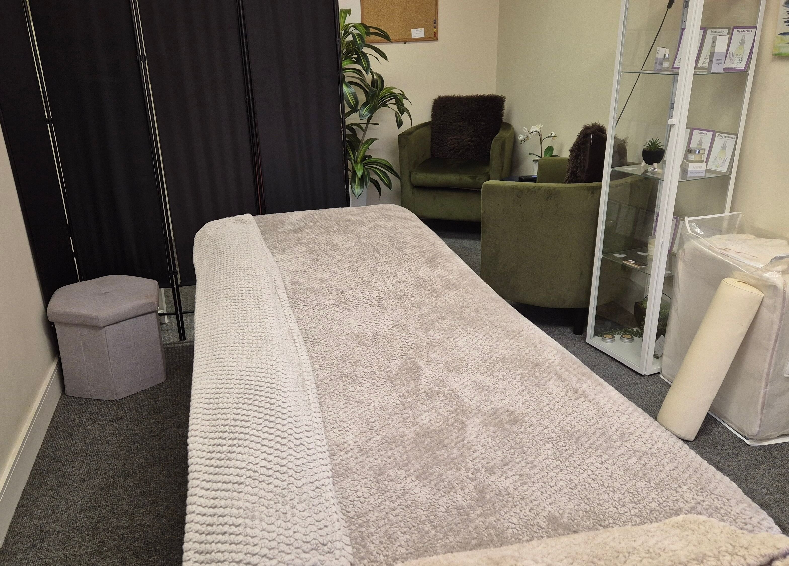 Cozy treatment room at Mandi O'Neill Holistics in Goole, England, GB with plush seating and ambient decor.