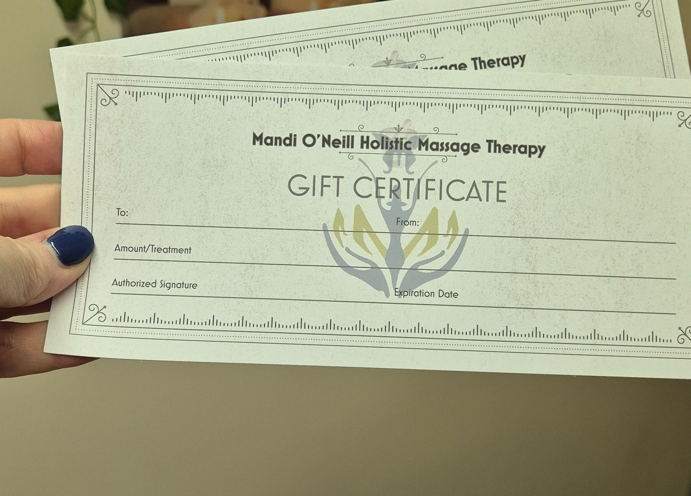 Gift certificate from Mandi O'Neill Holistics, Goole, England, GB, held in hand.