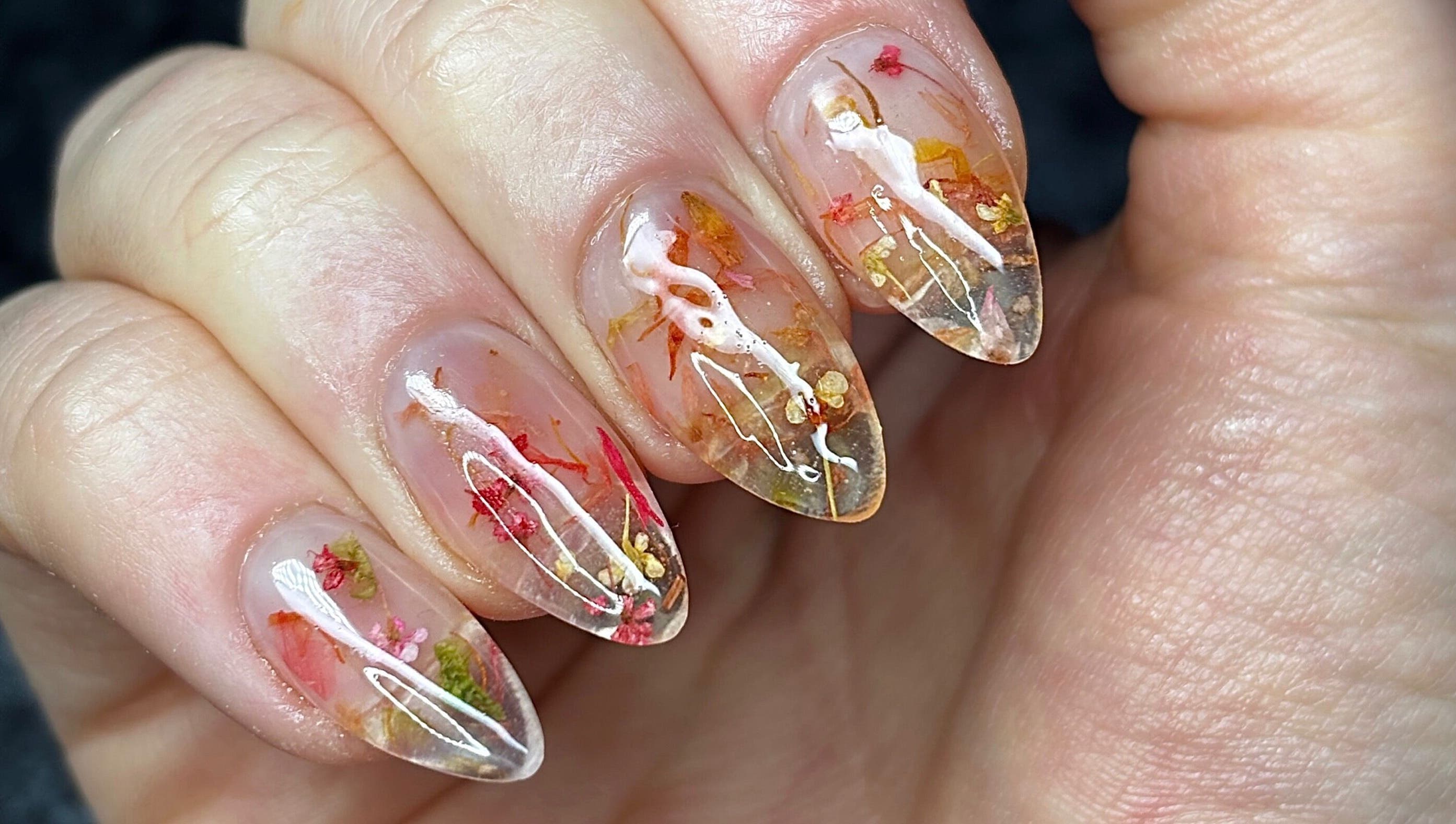 Floral nail art by Nails by Kyra M in Scunthorpe, England with intricate dried flower details.