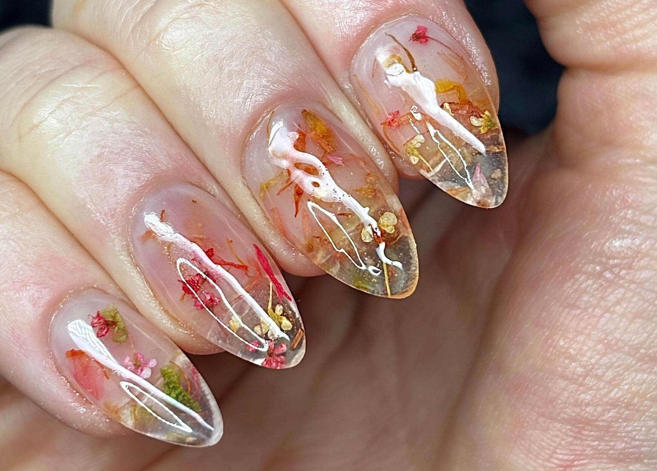 Floral nail art by Nails by Kyra M in Scunthorpe, England with intricate dried flower details.