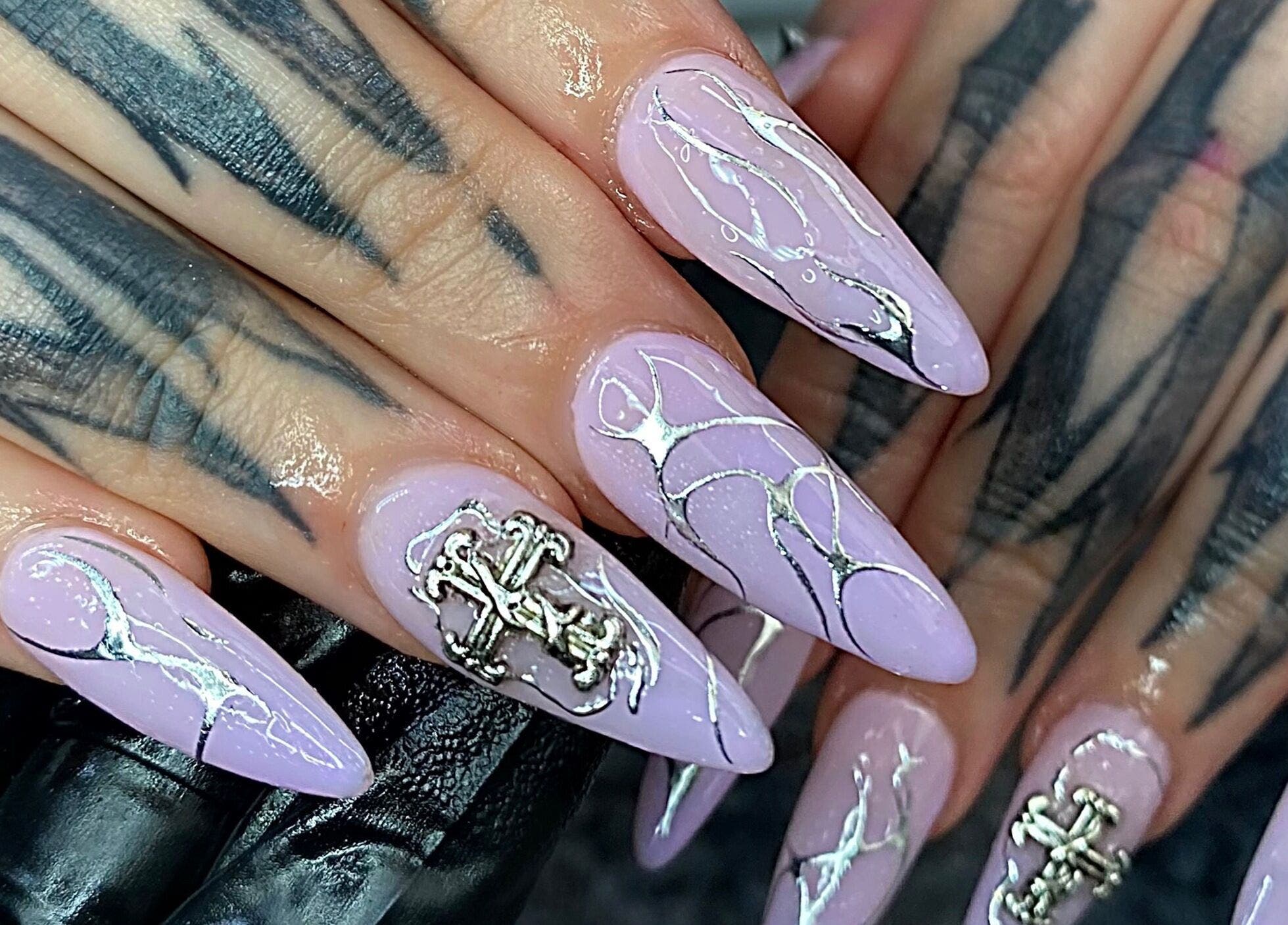 Elegant lavender nails with silver designs at Nails by Kyra M, Scunthorpe, England, GB.