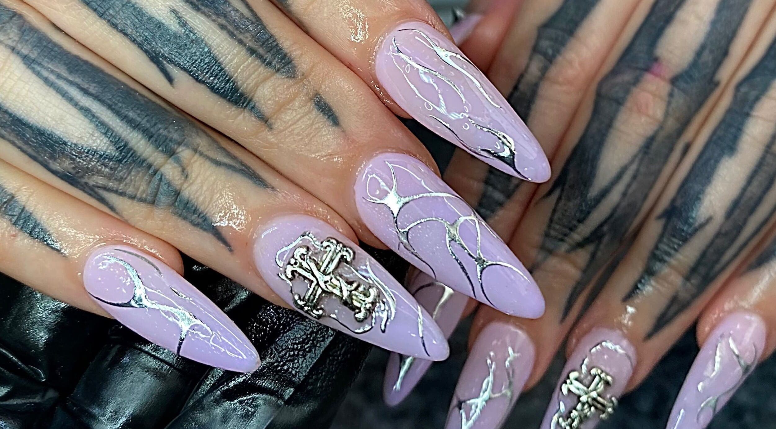 Elegant lavender nails with silver designs at Nails by Kyra M, Scunthorpe, England, GB.