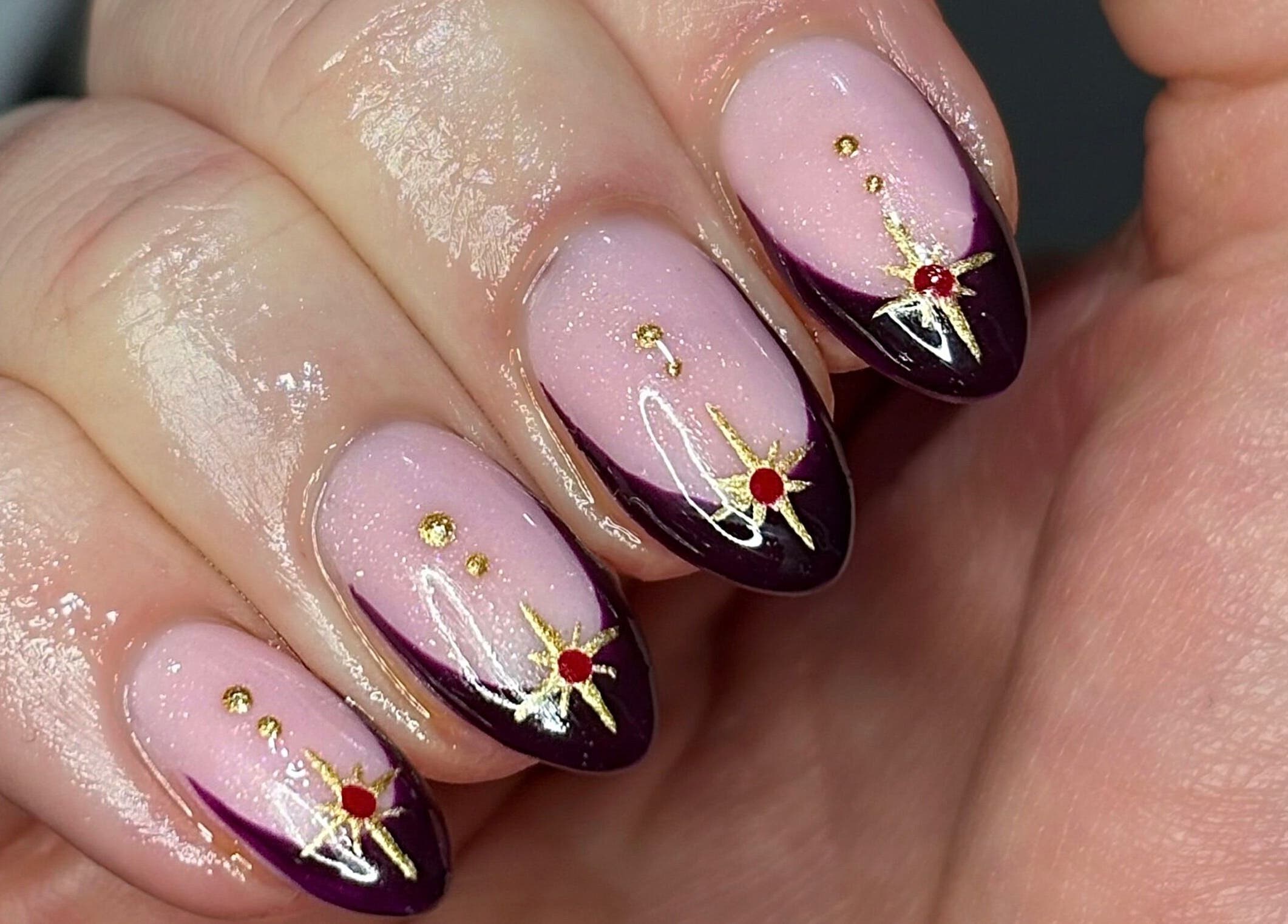 Elegant nail art with gold accents at Nails by Kyra M, Scunthorpe, England, GB.