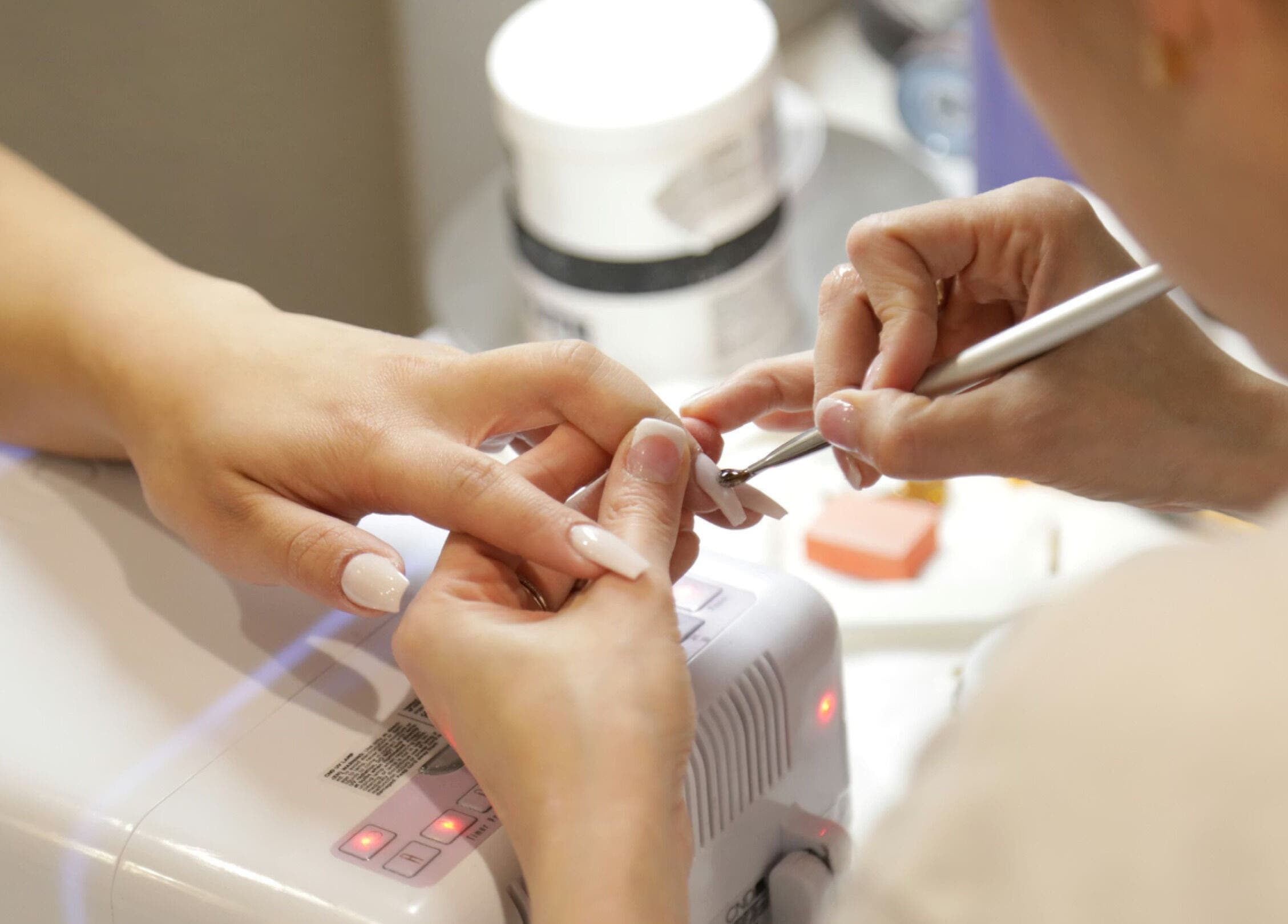 Nail technician perfecting manicure at Nails by Christina, Solihull, England, GB.