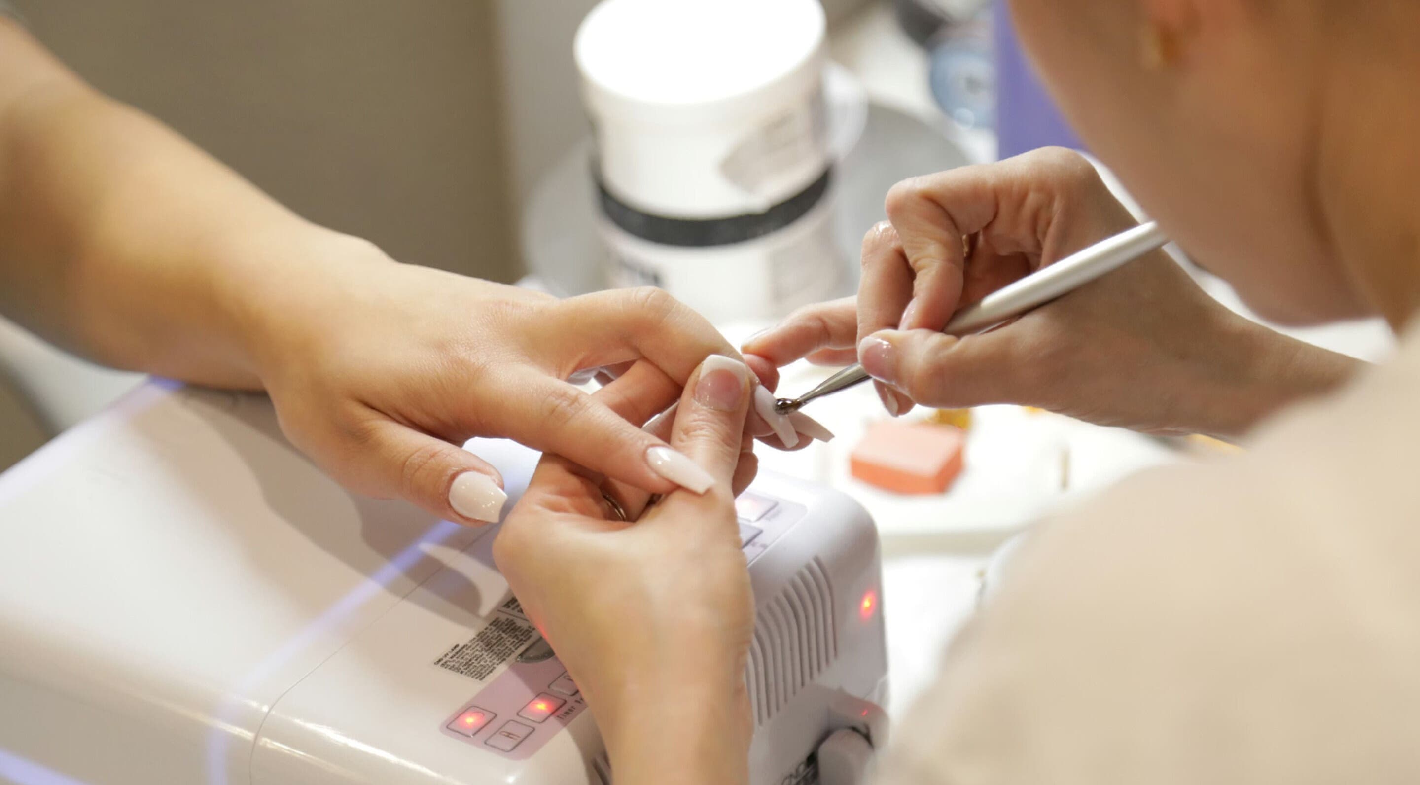 Nail technician perfecting manicure at Nails by Christina, Solihull, England, GB.