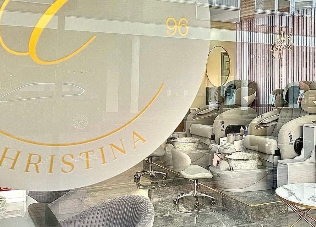 Chic interior of Nails by Christina, Solihull, England, GB with plush seating and nail stations.