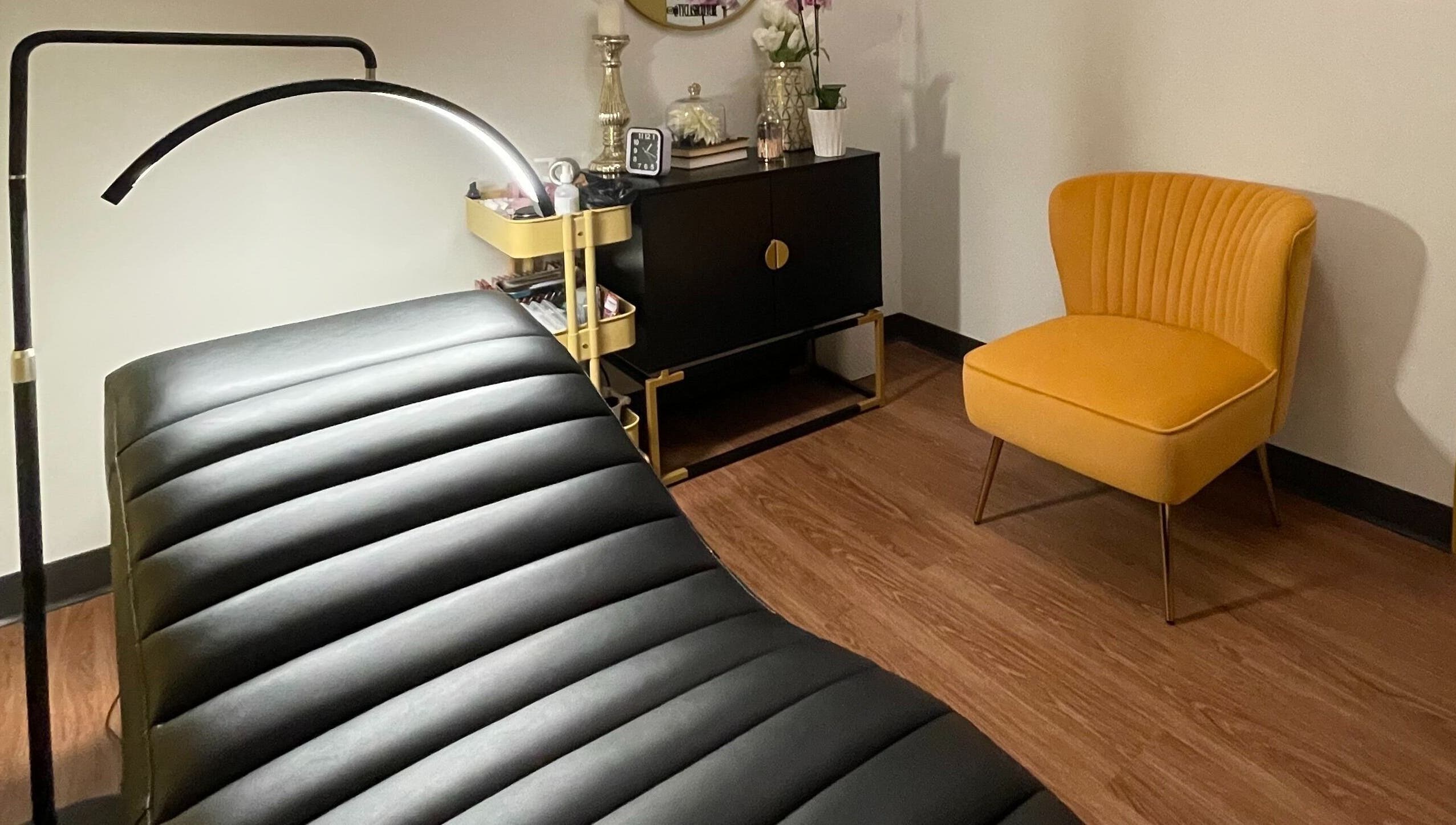 Lash Culture spa room with elegant decor and treatment bed in Calgary, Alberta, CA.