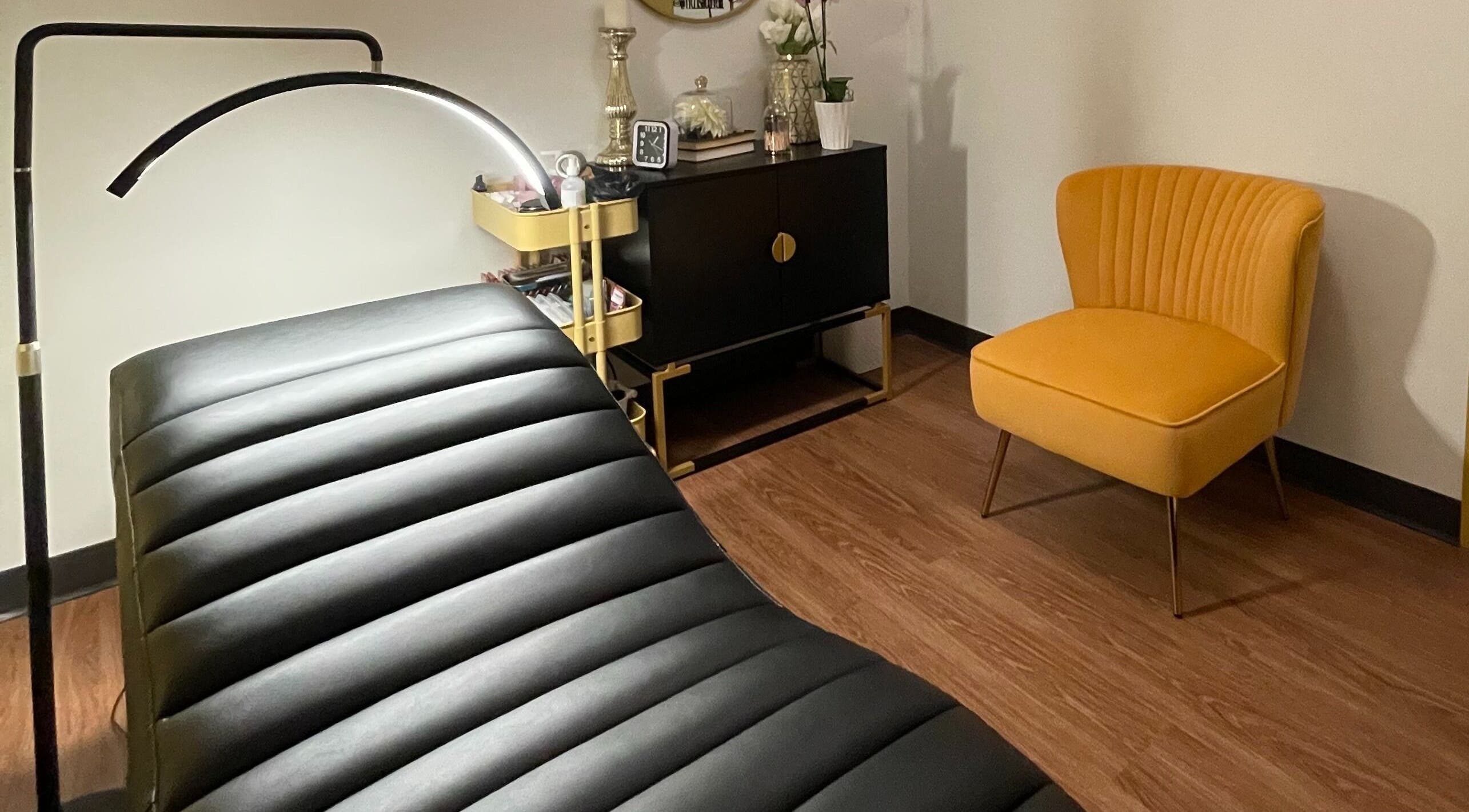 Lash Culture spa room with elegant decor and treatment bed in Calgary, Alberta, CA.