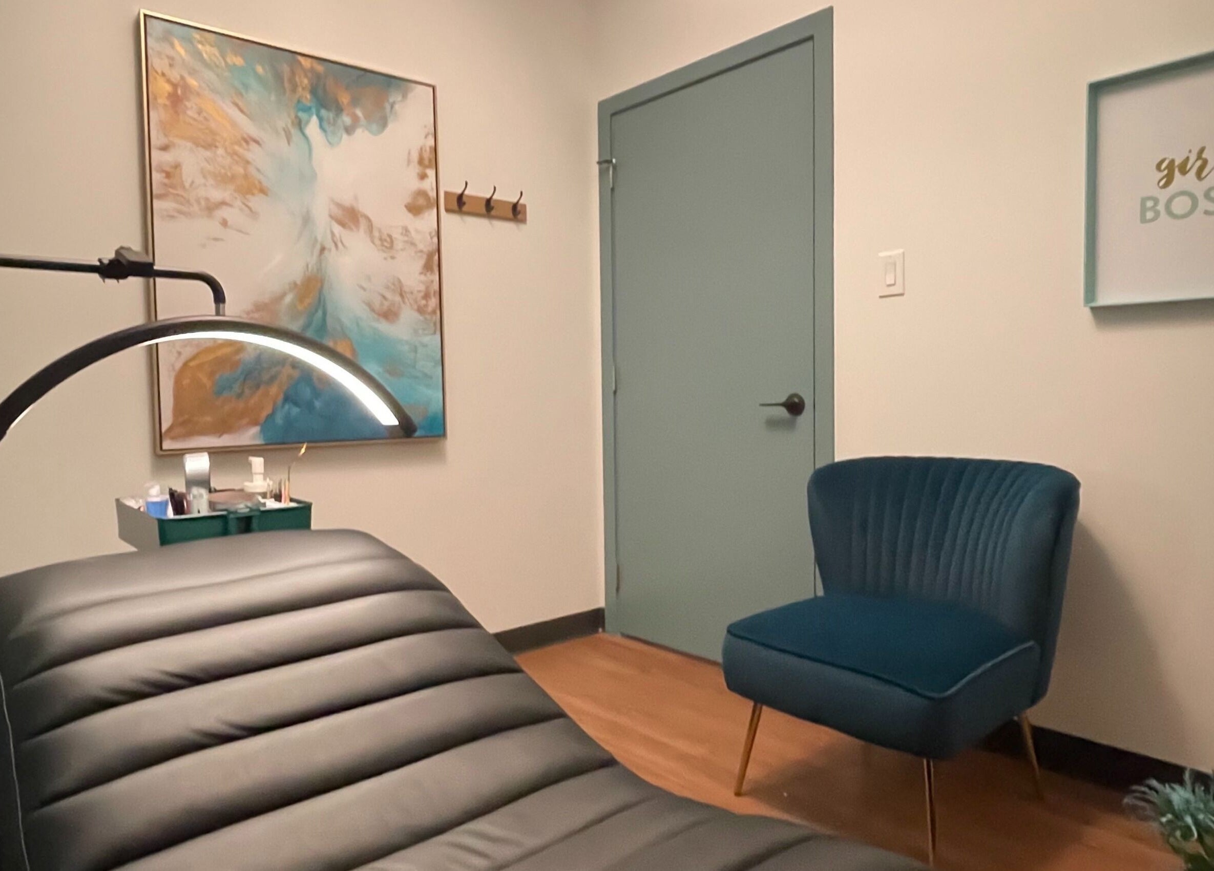 Cozy lash treatment room at Lash Culture, Calgary, Alberta, CA, featuring a plush chair and modern decor.