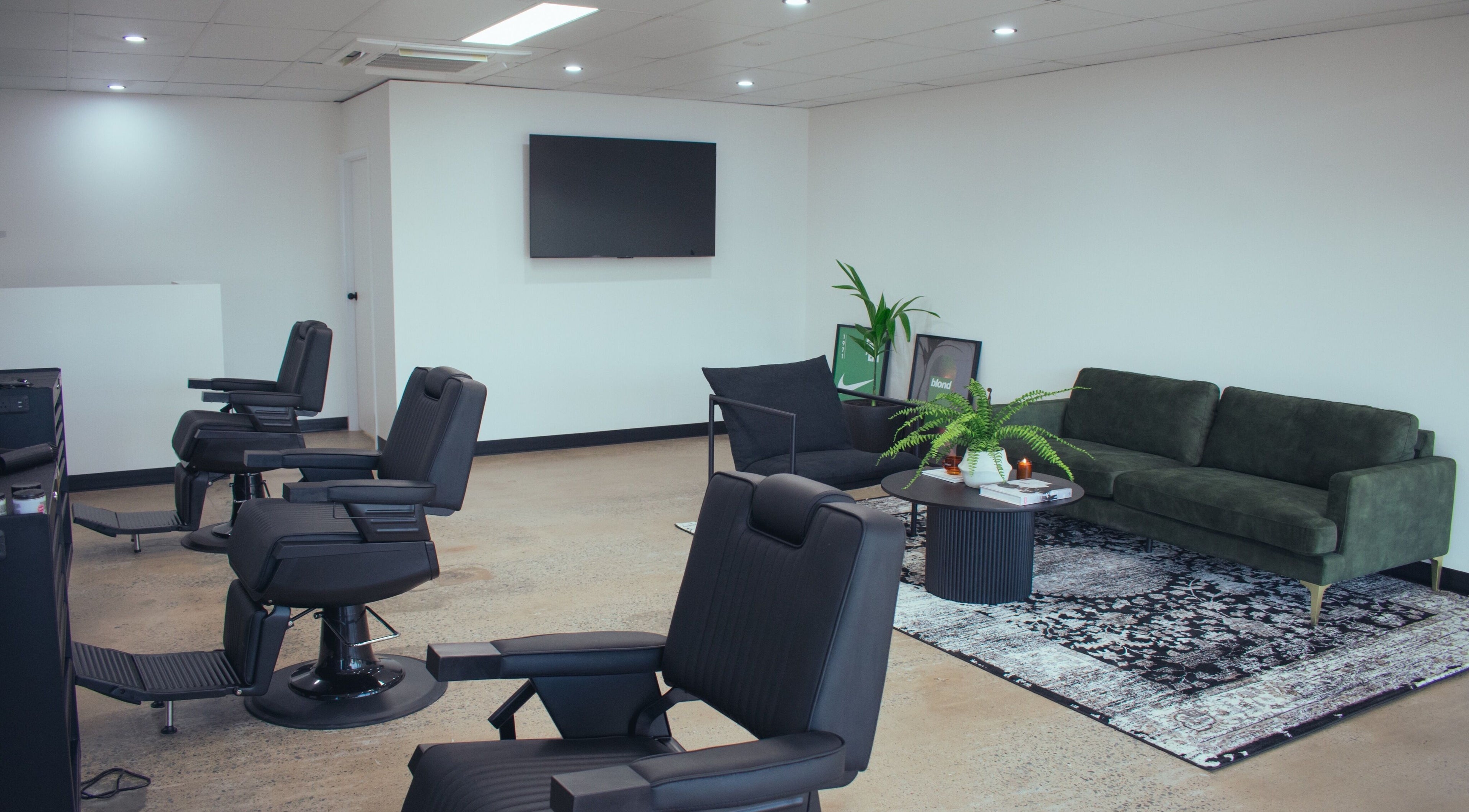 Modern seating area and styling chairs at MDRN Studio, Mackay, Queensland, AU. Sleek and inviting interior.