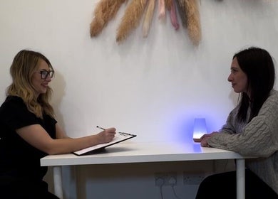 Client consultation at KLH Nurse Led Aesthetics in Morley, England, GB with warm ambient lighting.