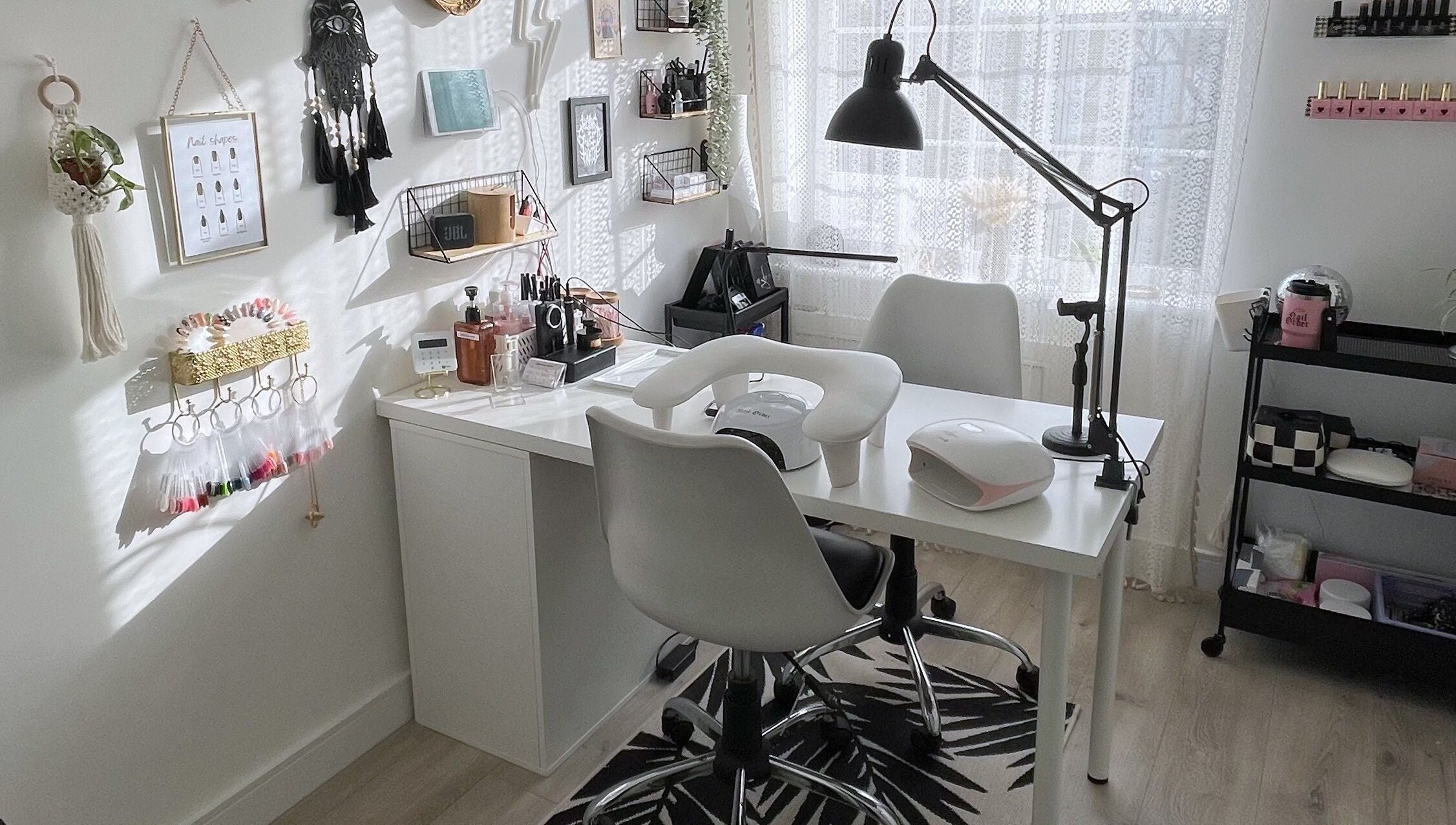 Modern nail salon setup at BeautyBits, Bristol, England, GB, featuring sleek chairs and organized nail tools.