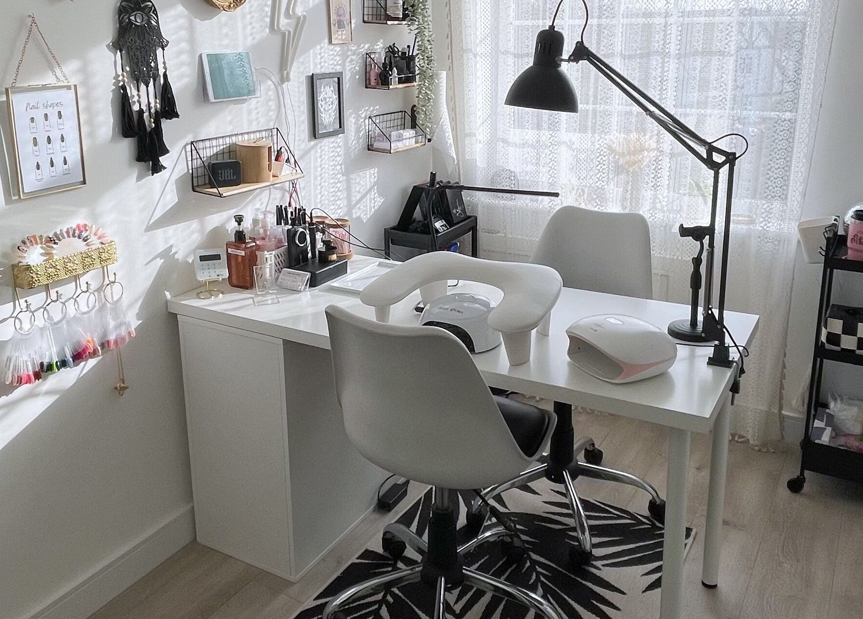 Modern nail salon setup at BeautyBits, Bristol, England, GB, featuring sleek chairs and organized nail tools.