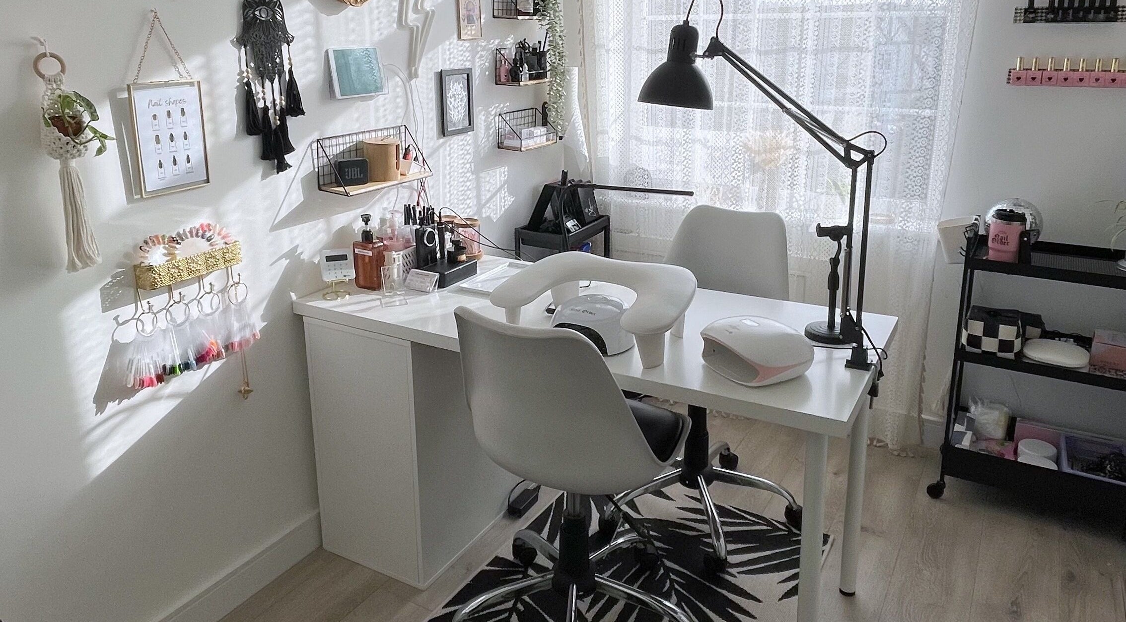 Modern nail salon setup at BeautyBits, Bristol, England, GB, featuring sleek chairs and organized nail tools.