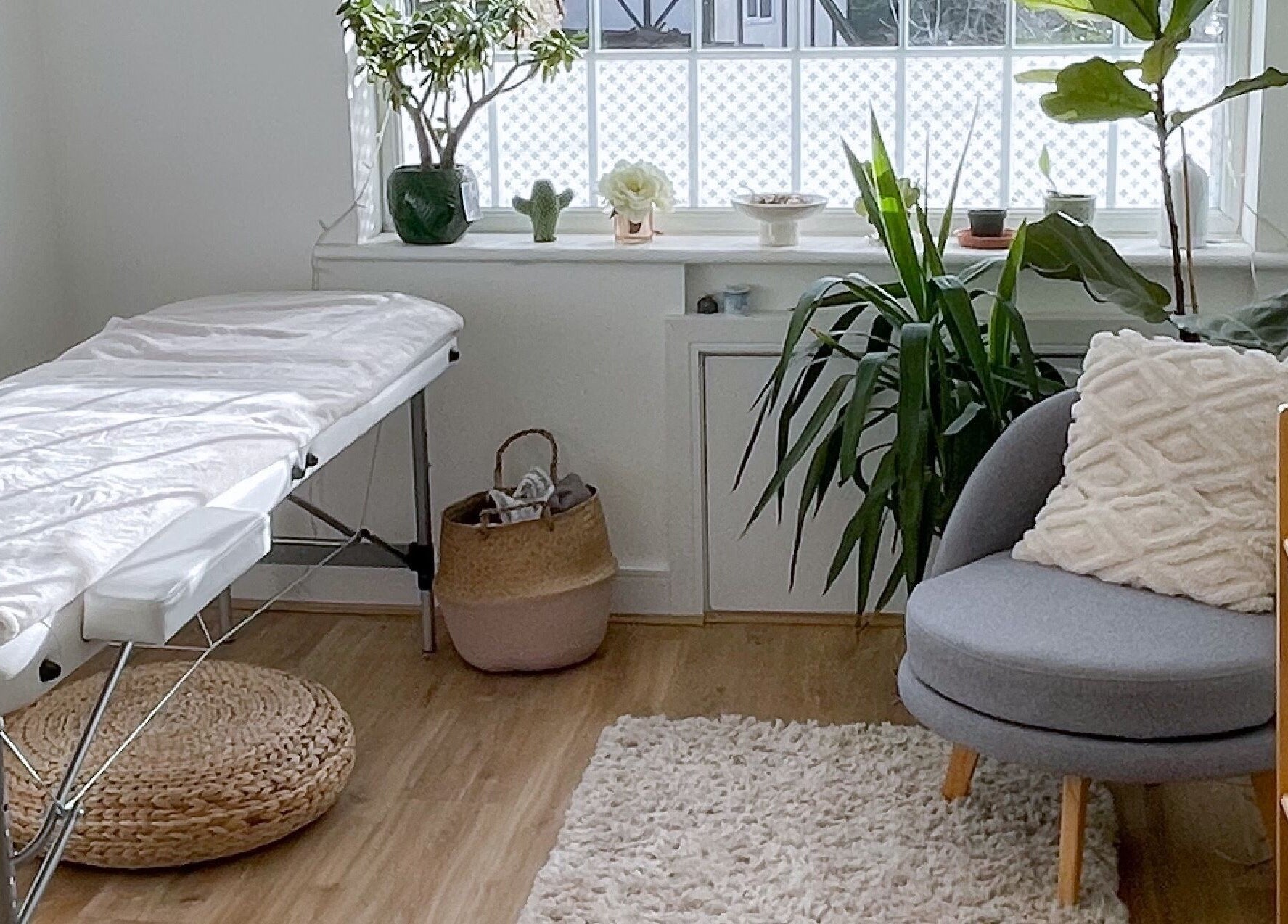 Elegant spa room at BeautyBits, Bristol, England, GB, with massage table and calming decor.