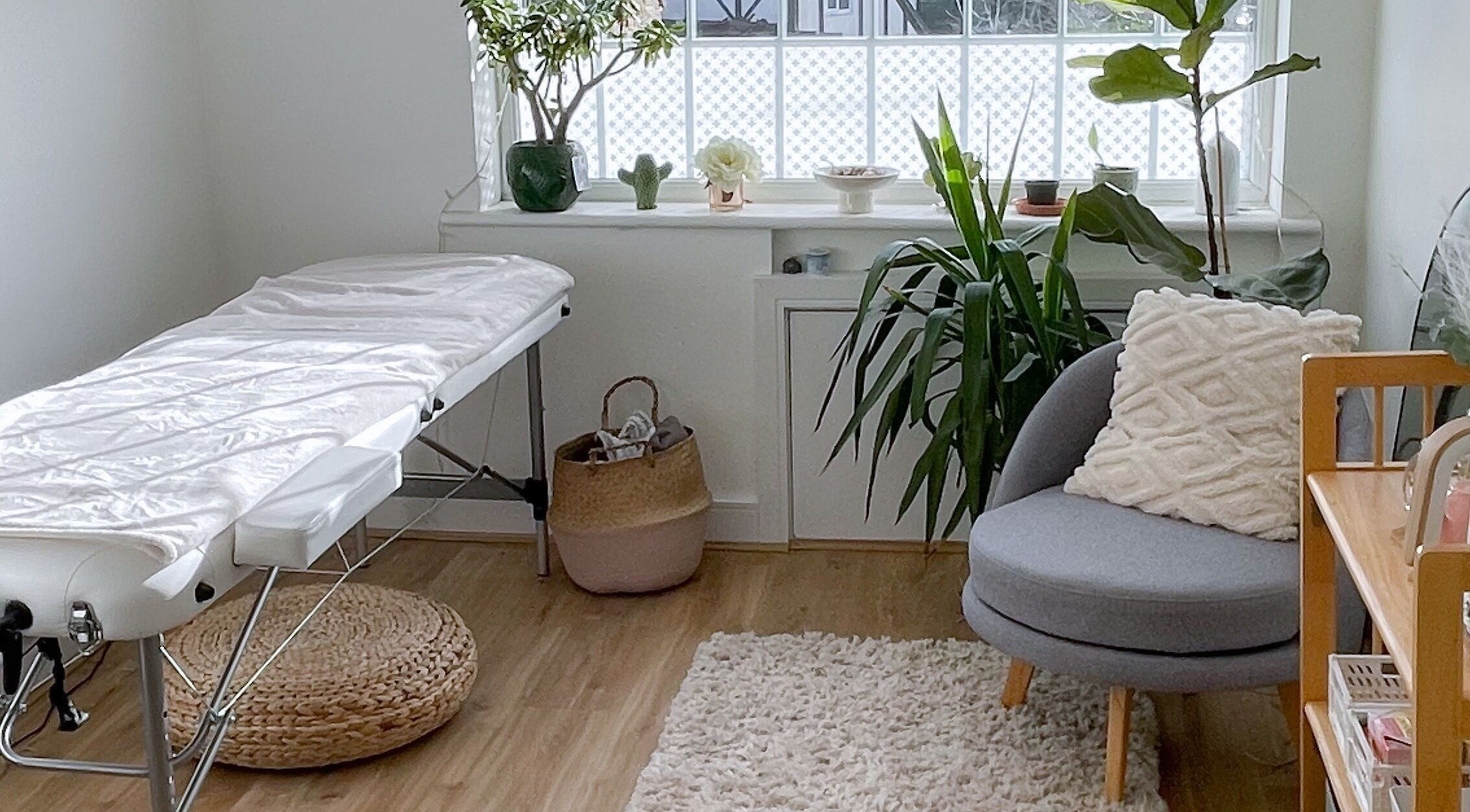 Elegant spa room at BeautyBits, Bristol, England, GB, with massage table and calming decor.