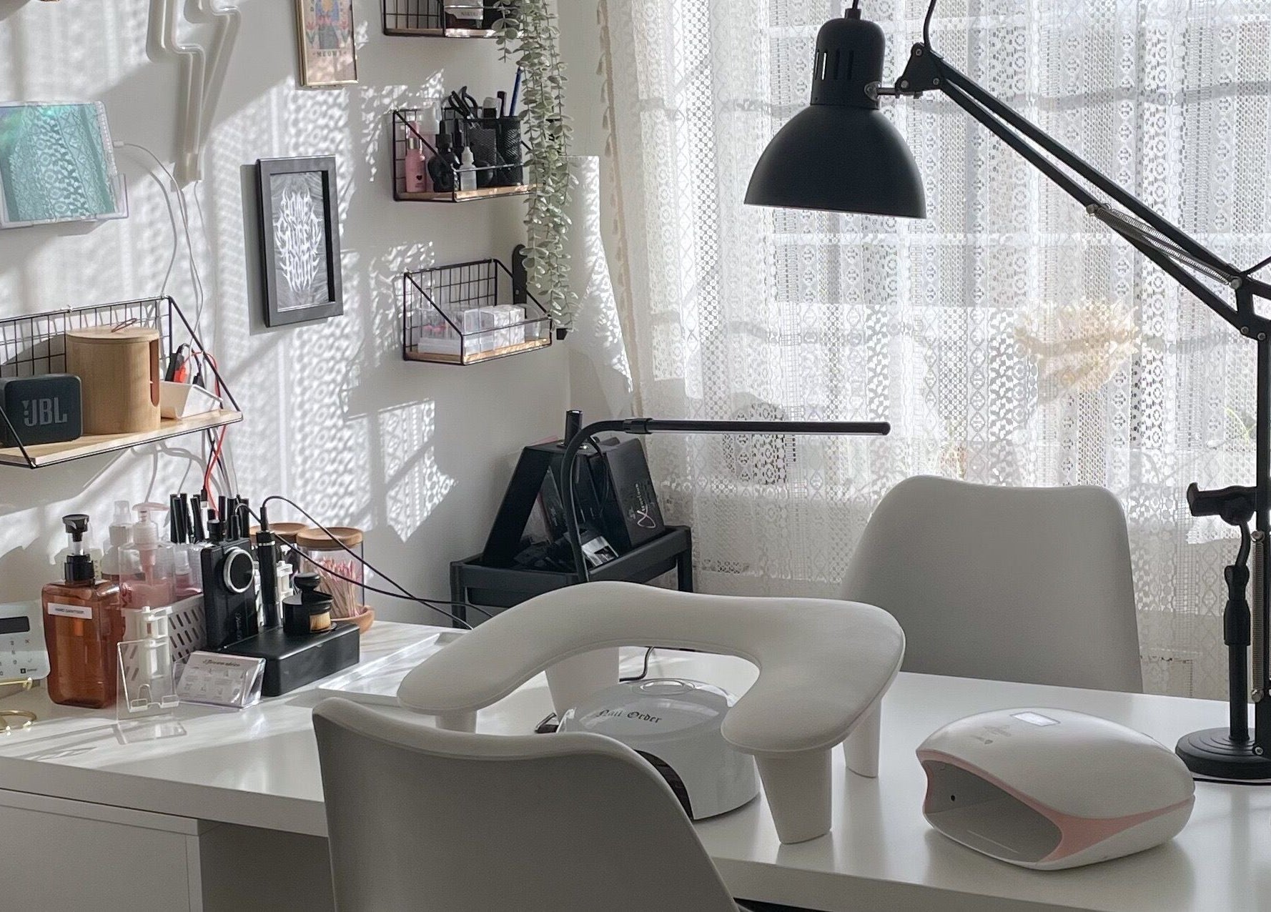 Modern nail salon workspace at BeautyBits, Bristol, England, GB, featuring elegant decor and equipment.