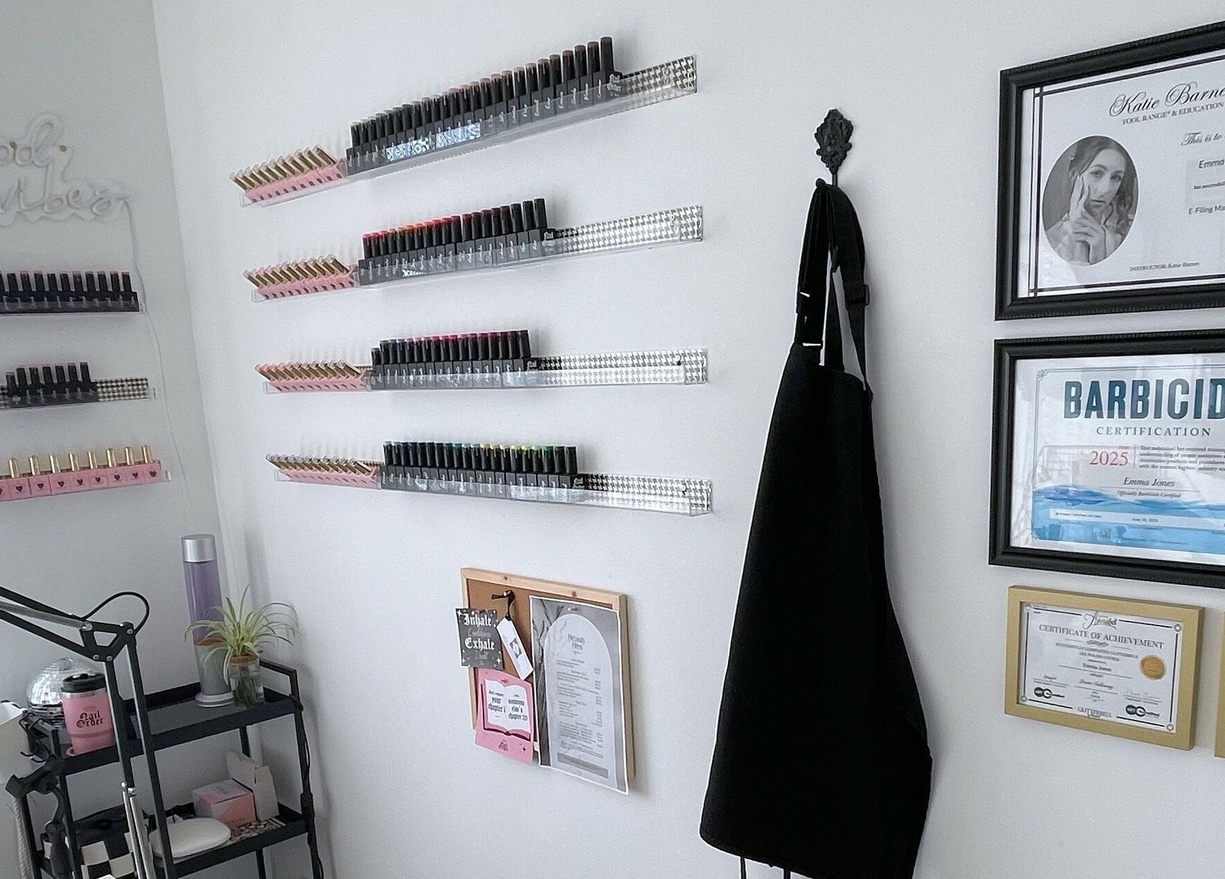 Stylish nail polish shelves and certificates at BeautyBits, Bristol, England, GB, creating a chic atmosphere.