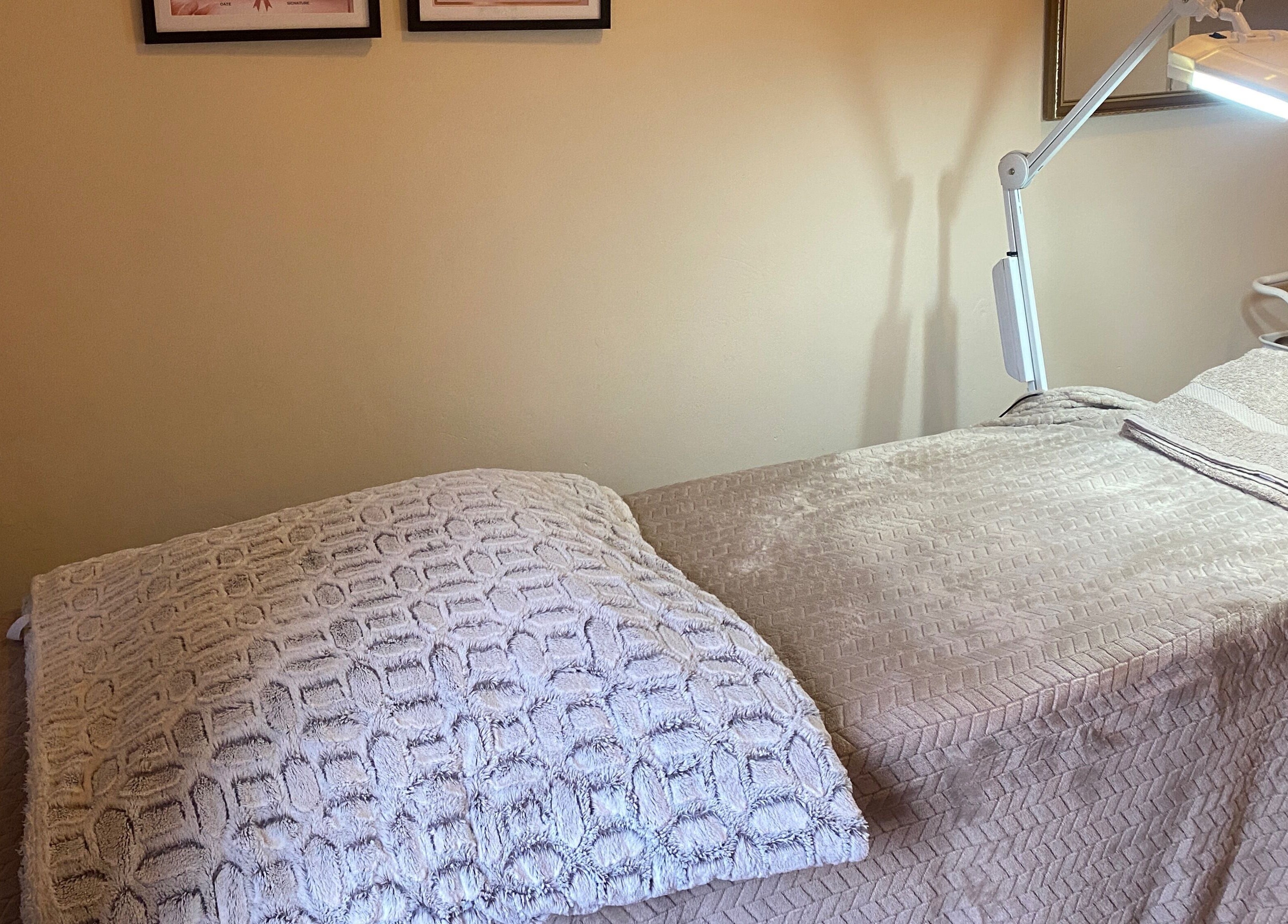 Inviting treatment bed at Feather Aesthetics, Bloemfontein, Free State, ZA, ready for clients.