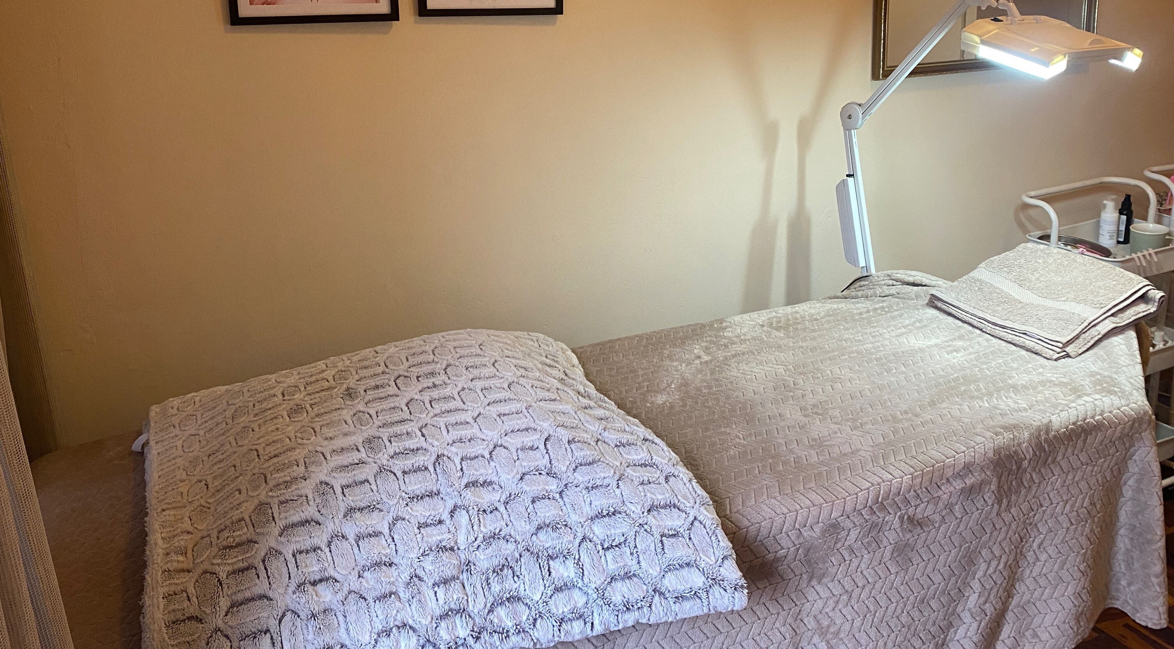 Inviting treatment bed at Feather Aesthetics, Bloemfontein, Free State, ZA, ready for clients.