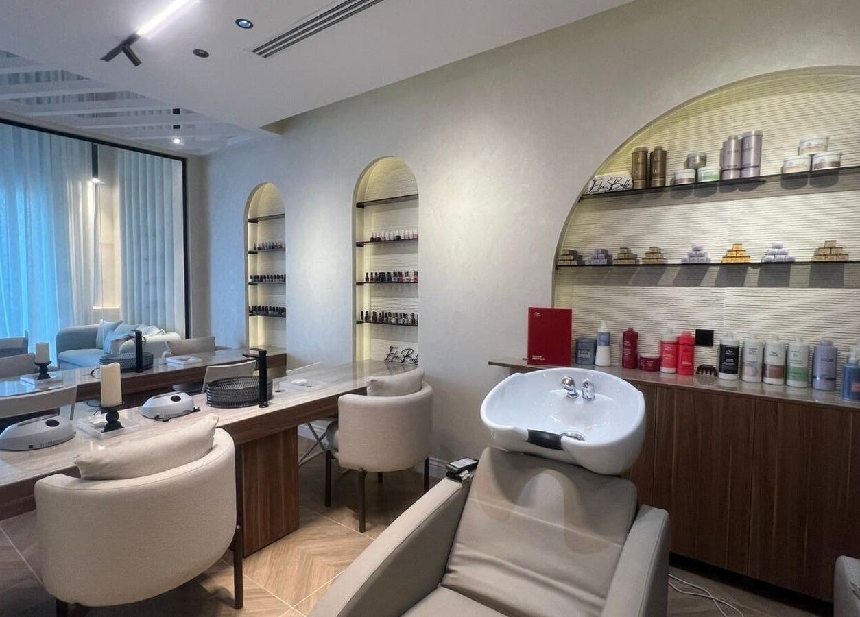 Chic and modern salon interior at Elee Belle in Al Khobar, Eastern Province, SA, featuring stylish seating and products.