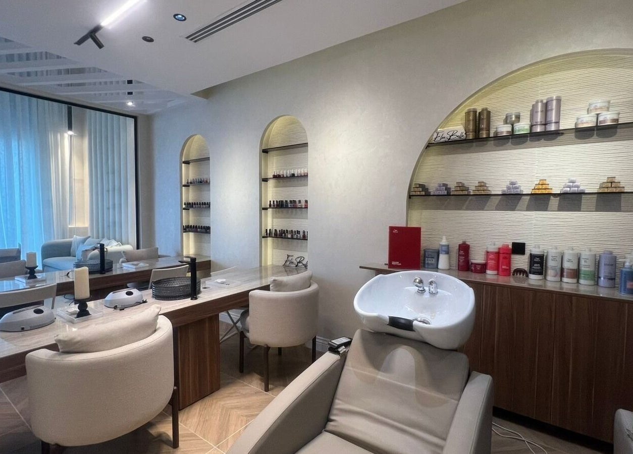 Chic and modern salon interior at Elee Belle in Al Khobar, Eastern Province, SA, featuring stylish seating and products.
