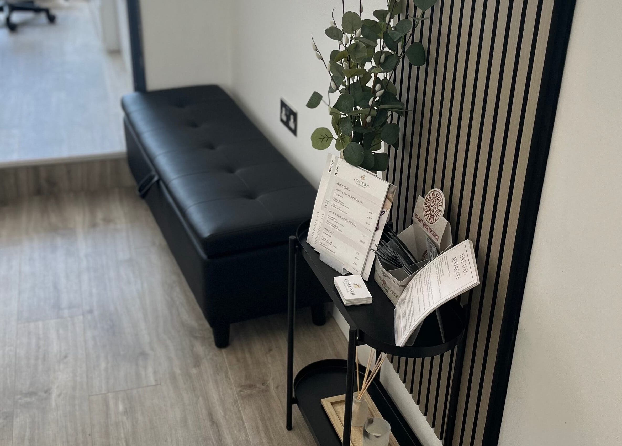 Sleek reception area in Complexion, Leighton Buzzard, GB with black bench and stylish décor.