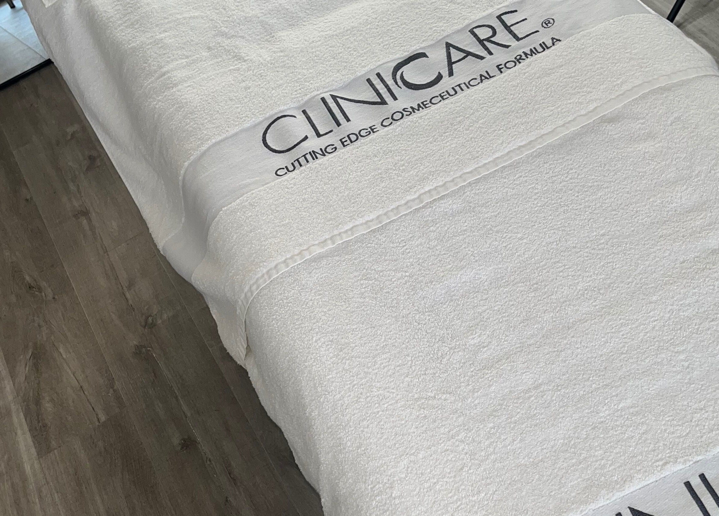 Treatment bed at Complexion, Leighton Buzzard, GB with luxurious white linens.