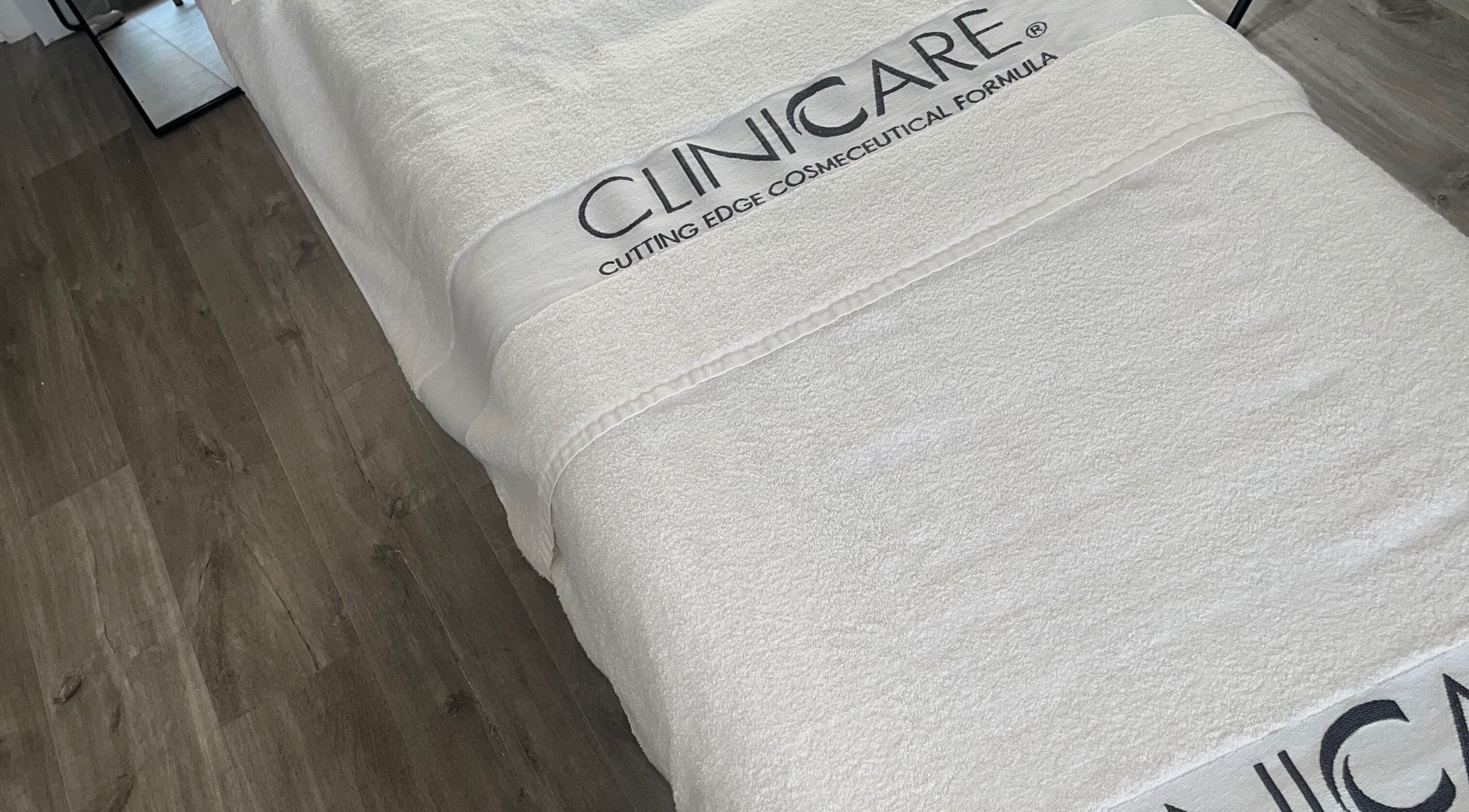 Treatment bed at Complexion, Leighton Buzzard, GB with luxurious white linens.