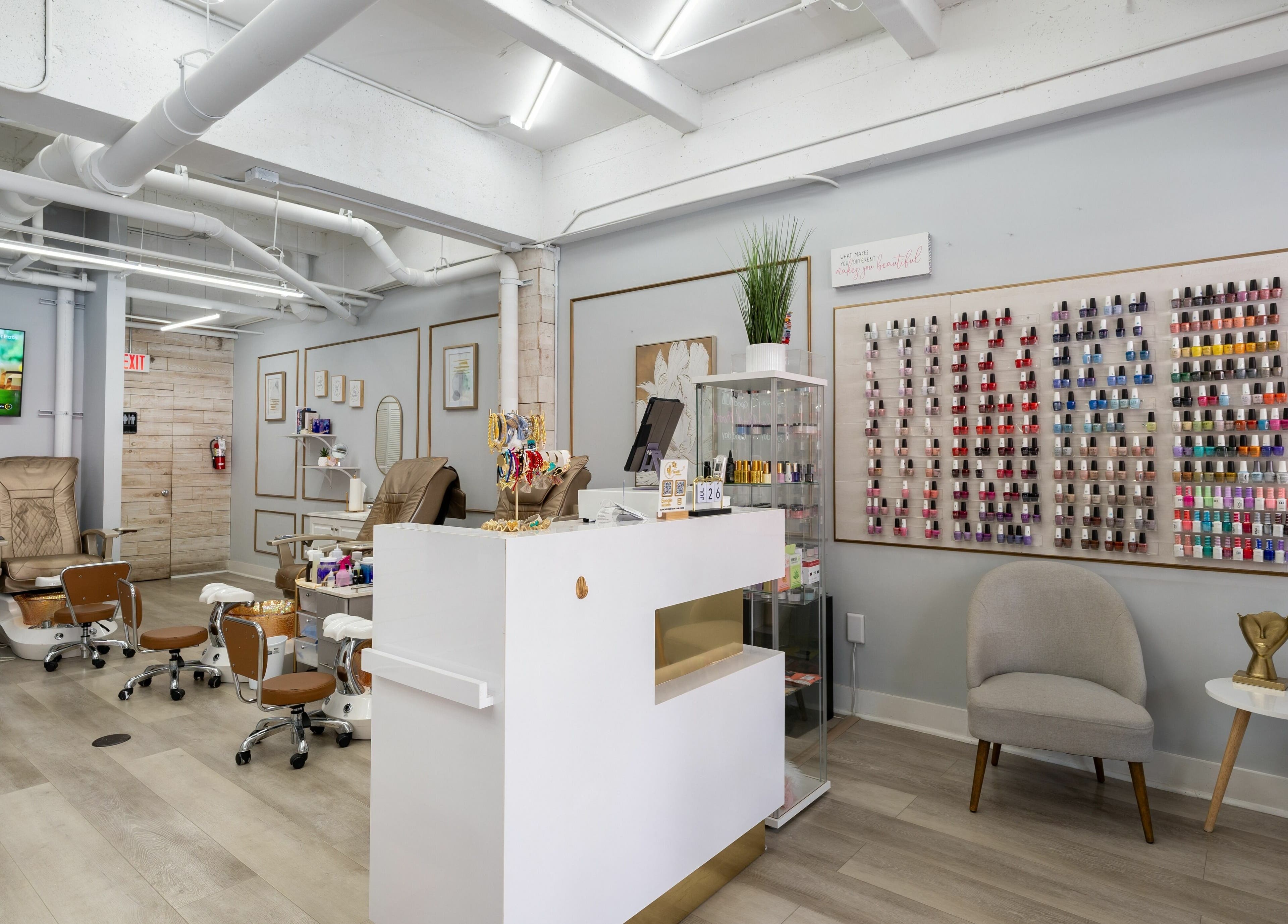Elegant interior of Nail Nova Salon & Spa in Miami Lakes, Florida, US, showcasing chic decor and nail polish display.