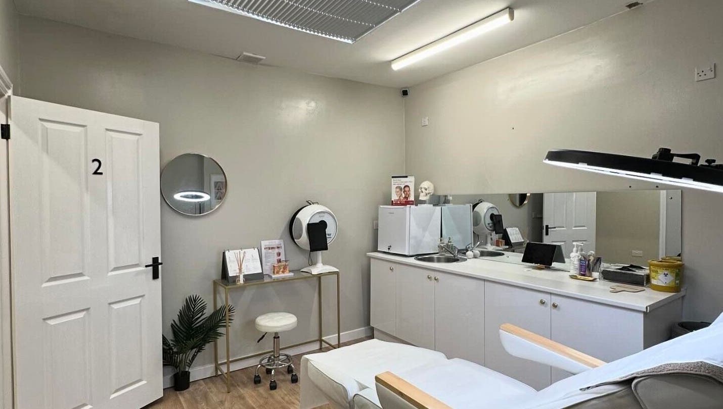 Sleek wellness room at B-Radiant, Glynneath, Wales, GB, featuring modern treatment bed and ambient lighting.