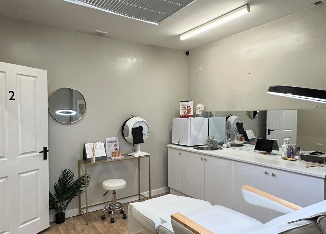 Sleek wellness room at B-Radiant, Glynneath, Wales, GB, featuring modern treatment bed and ambient lighting.