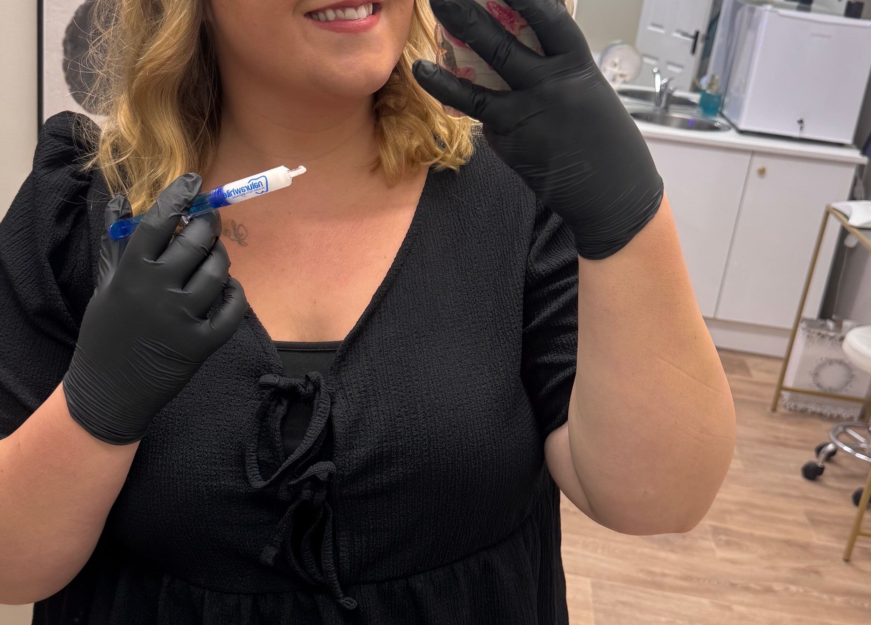 Skilled B-Radiant staff in Glynneath, Wales, GB, preparing a beauty treatment with precision.