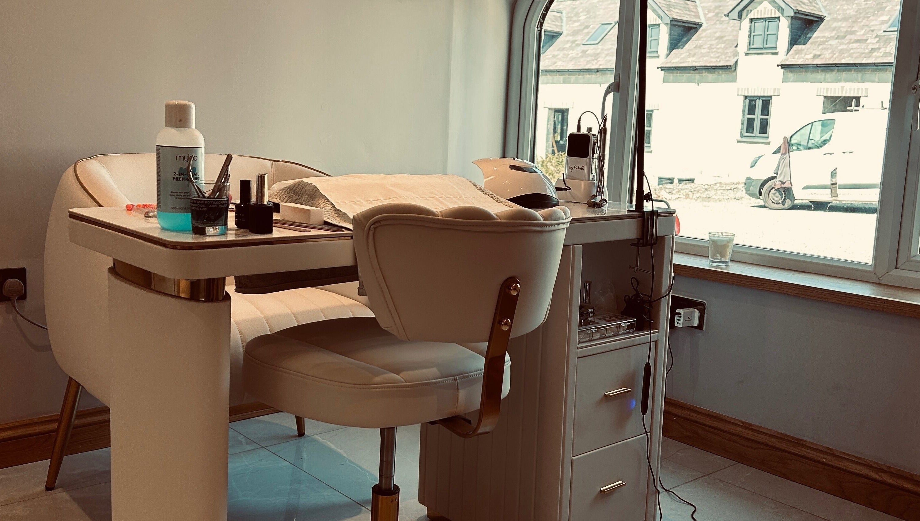 Elegant manicure setup at Biwti Mer in Gorsgoch, Wales, GB, featuring stylish chair and nail tools.