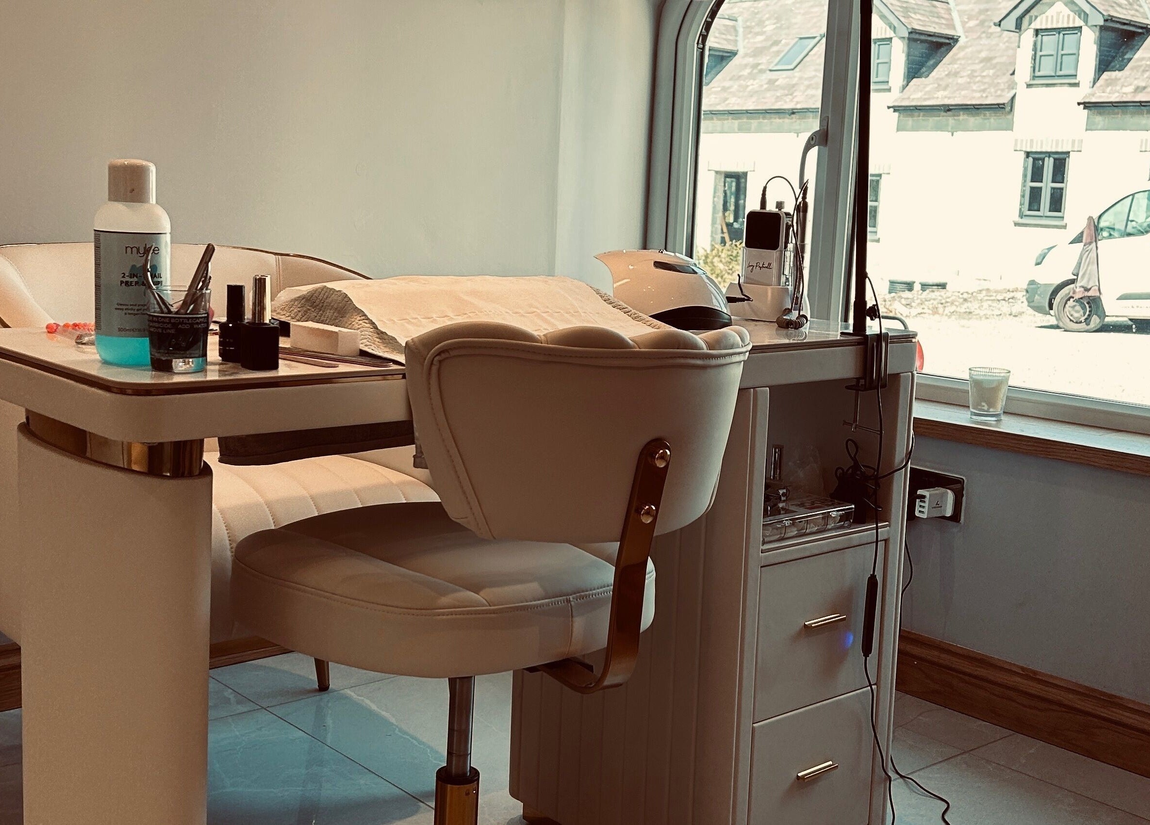 Elegant manicure setup at Biwti Mer in Gorsgoch, Wales, GB, featuring stylish chair and nail tools.
