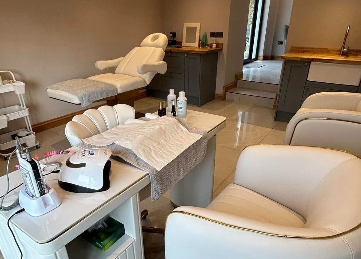 Elegant beauty treatment room at Biwti Mer, Gorsgoch, Wales, GB, featuring plush chairs and modern equipment.