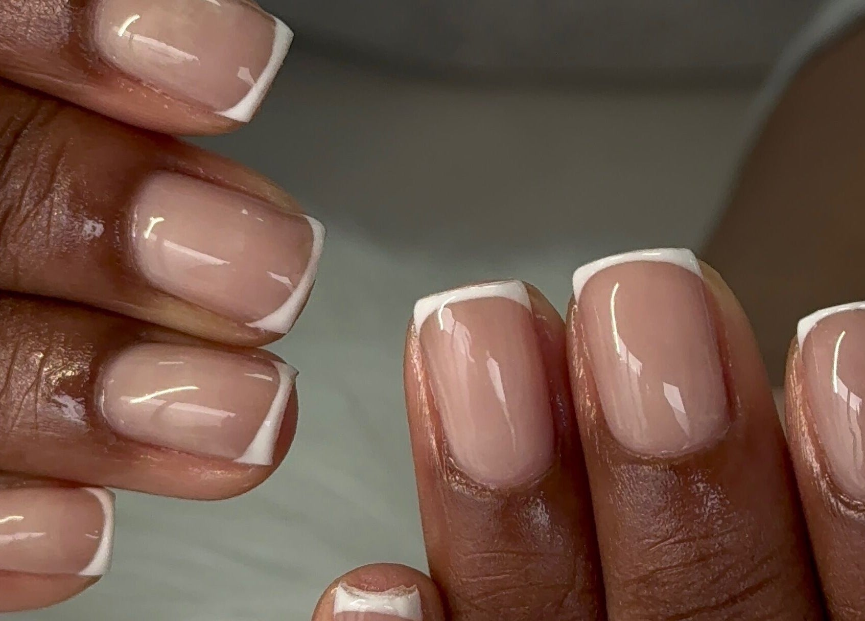 Beautiful French manicure at Glam Aura Studio, Leeds, England, GB, showcasing elegant nail art.