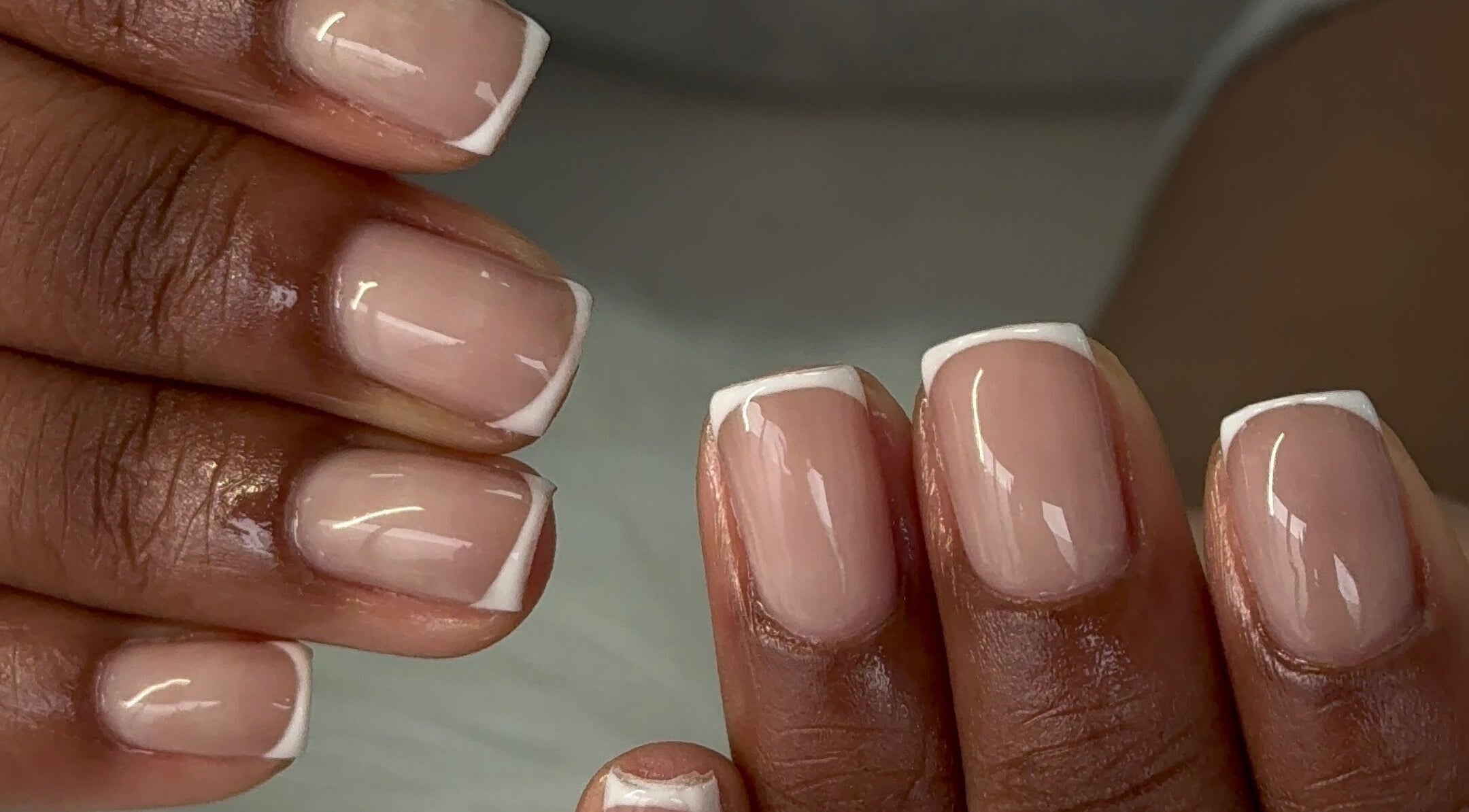 Beautiful French manicure at Glam Aura Studio, Leeds, England, GB, showcasing elegant nail art.