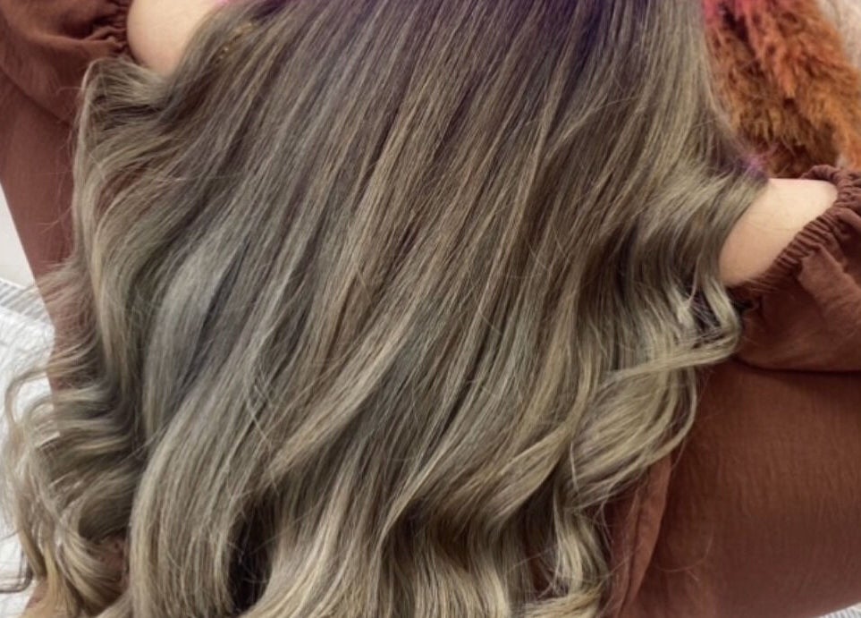 Elegant wavy hairstyle at Glam Aura Studio in Leeds, England, GB, showcasing luxurious hair treatment.