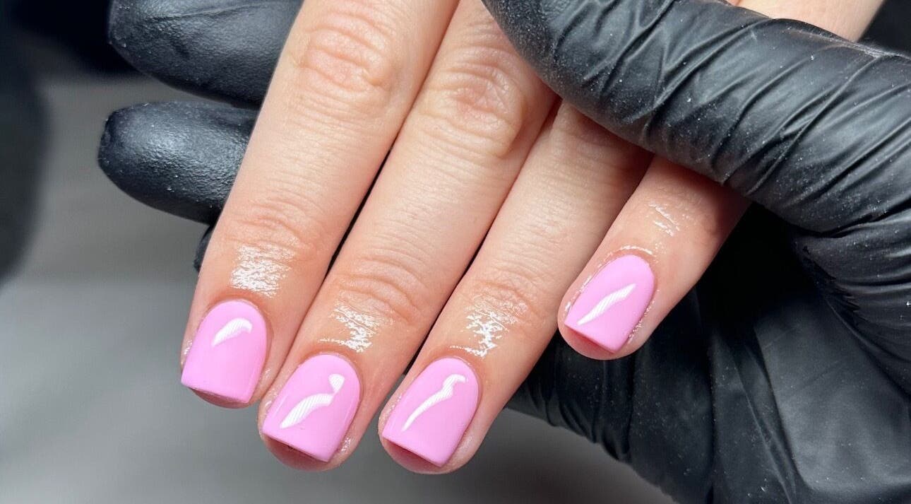 Manicure with pink polish at Olive&Co, St helier, JE offering professional nail care services.