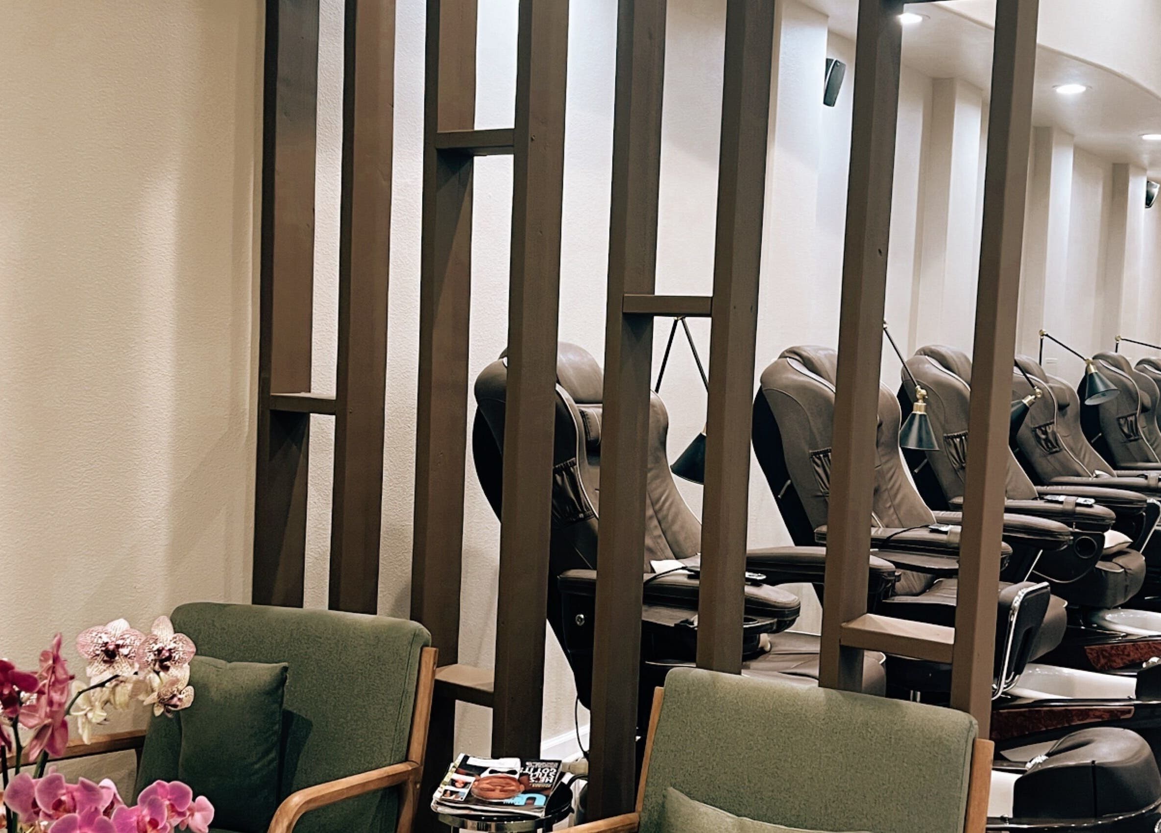 Relaxing pedicure chairs at Nirvana Nails Studio in Studio City, California, US, with beautiful orchids.