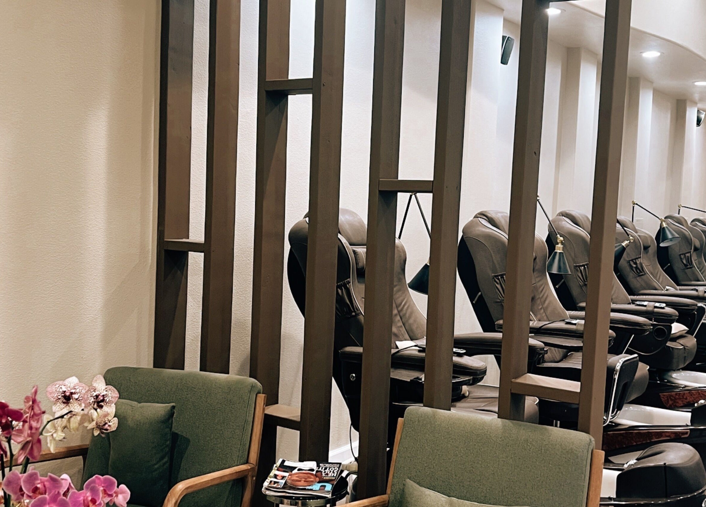 Relaxing pedicure chairs at Nirvana Nails Studio in Studio City, California, US, with beautiful orchids.