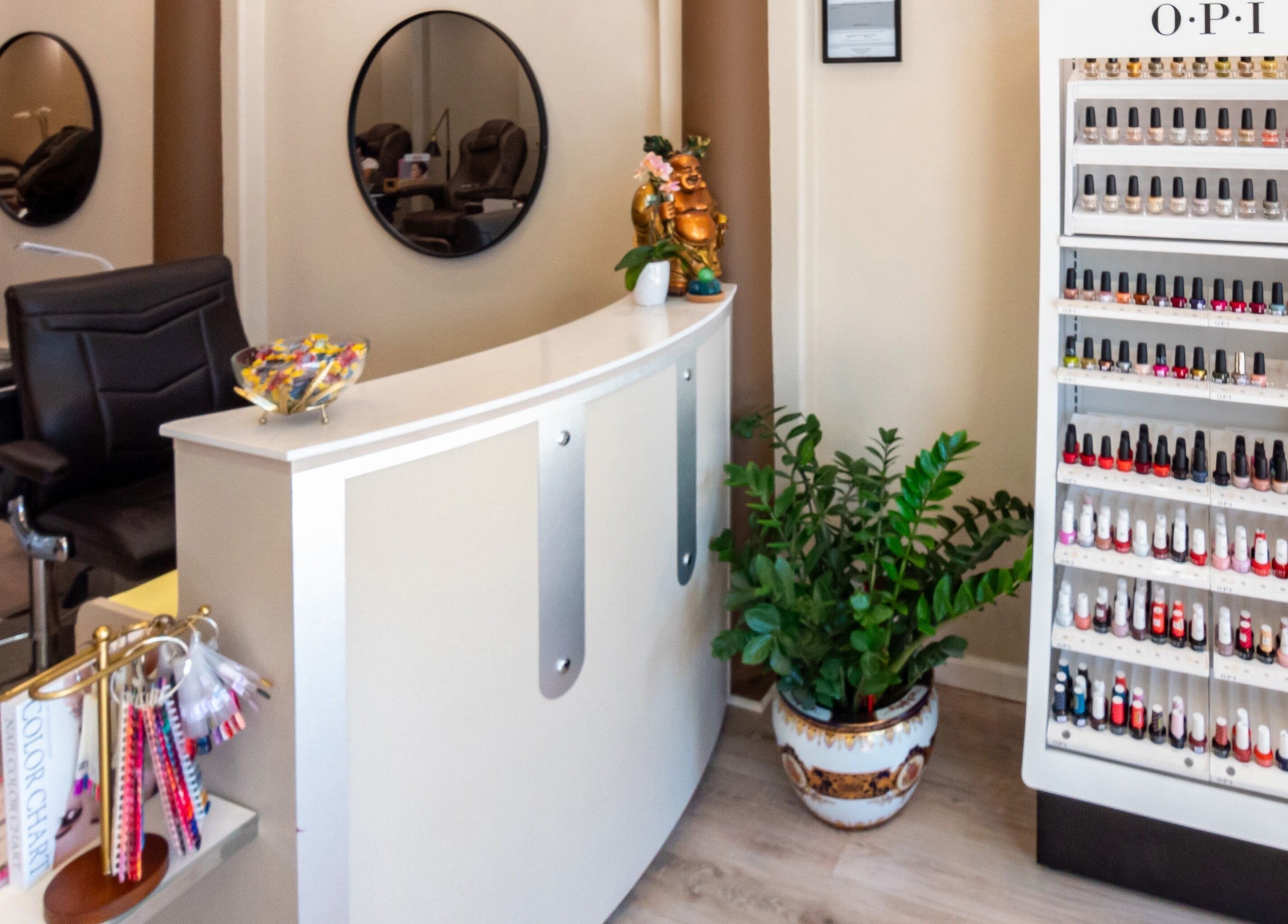 Stylish reception at Nirvana Nails Studio, Studio City, California, US with nail polish display and elegant decor.