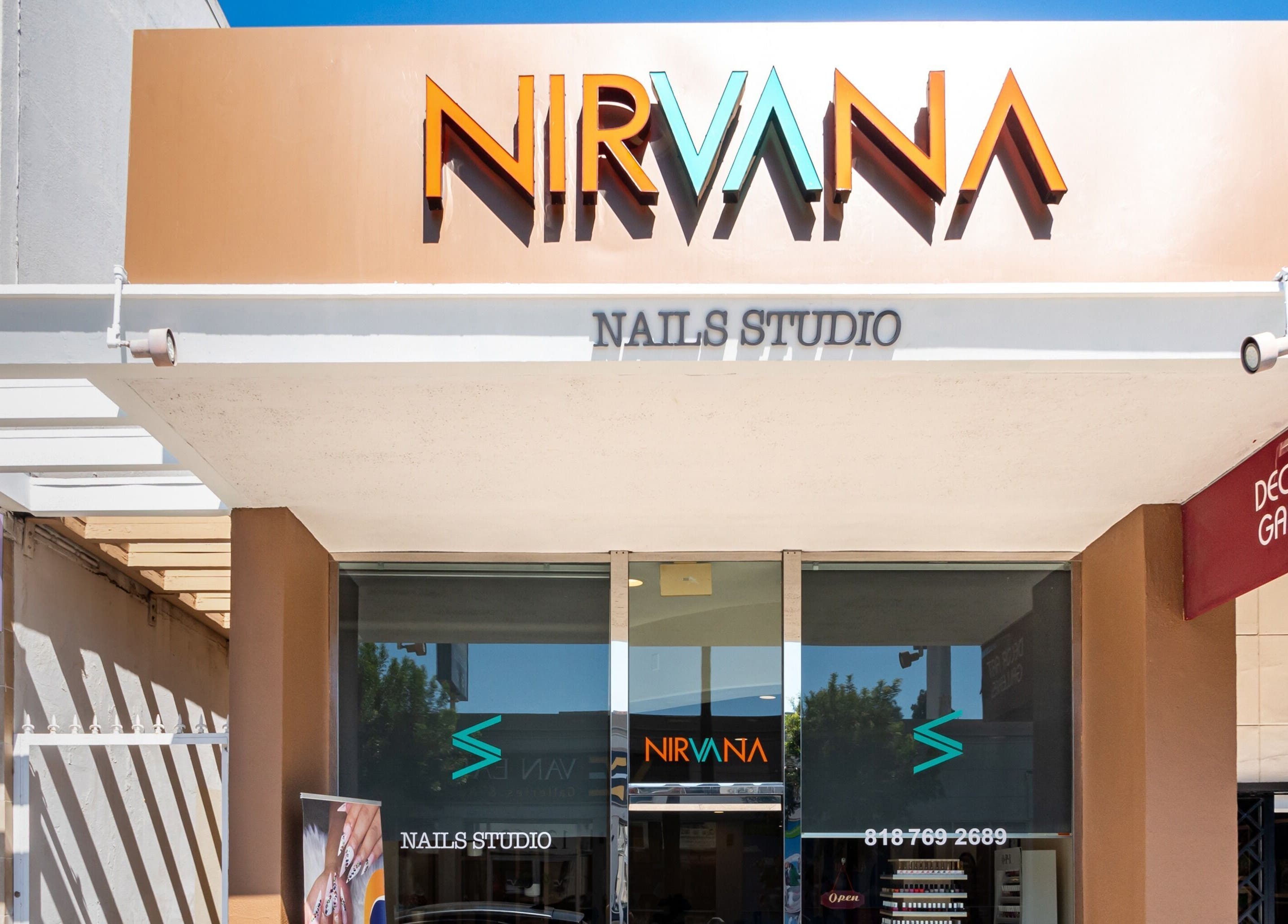 Nirvana Nails Studio entrance in Studio City, California, US with logo and signage.