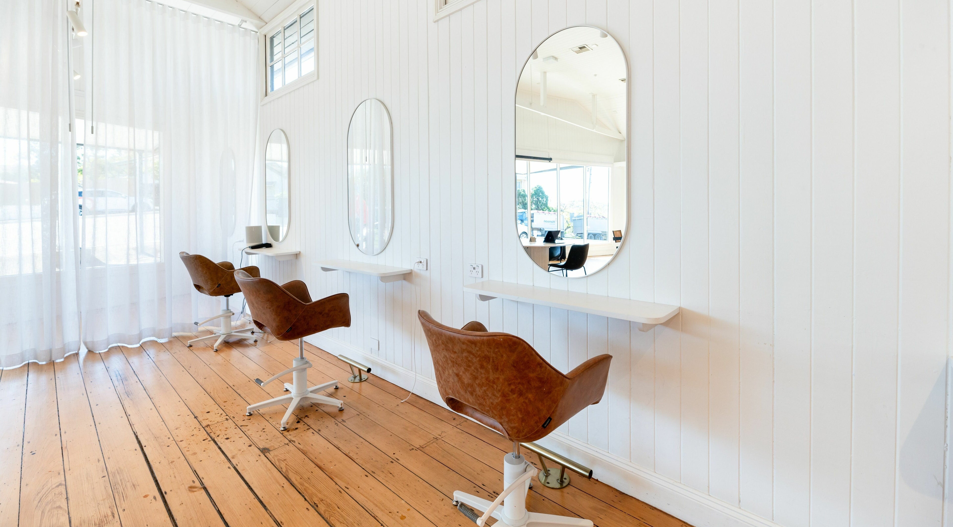 Chic salon chairs and mirrors at The Mane Society in Kelvin Grove, Queensland, AU. Modern, bright, inviting space.