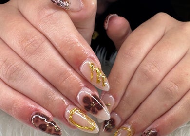 Elegant manicure with gold and floral designs from Beauty by Lily in Gosnells, Western Australia, AU.