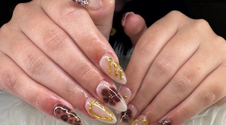 Elegant manicure with gold and floral designs from Beauty by Lily in Gosnells, Western Australia, AU.