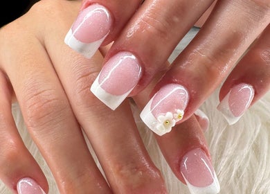 Elegant French manicure with floral detail by Beauty by Lily in Gosnells, Western Australia, AU.