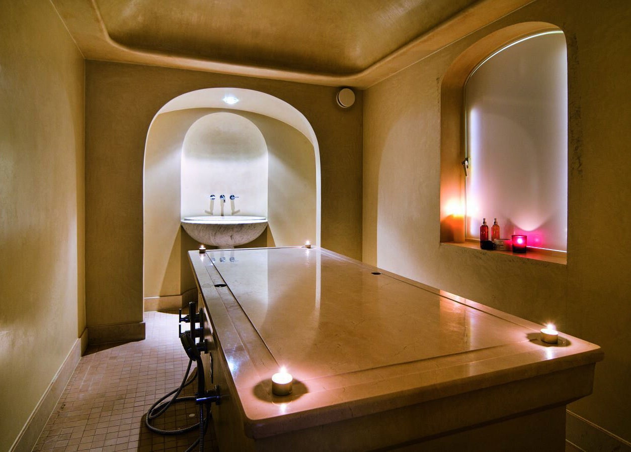 Elegant spa treatment room at Sofitel Legend The Grand Amsterdam, Amsterdam, Noord-Holland, NL with ambient lighting.