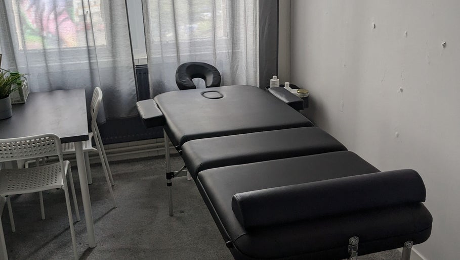 Massage table and seating area at Garry Christie Sports Massage, Glasgow, Scotland, GB.